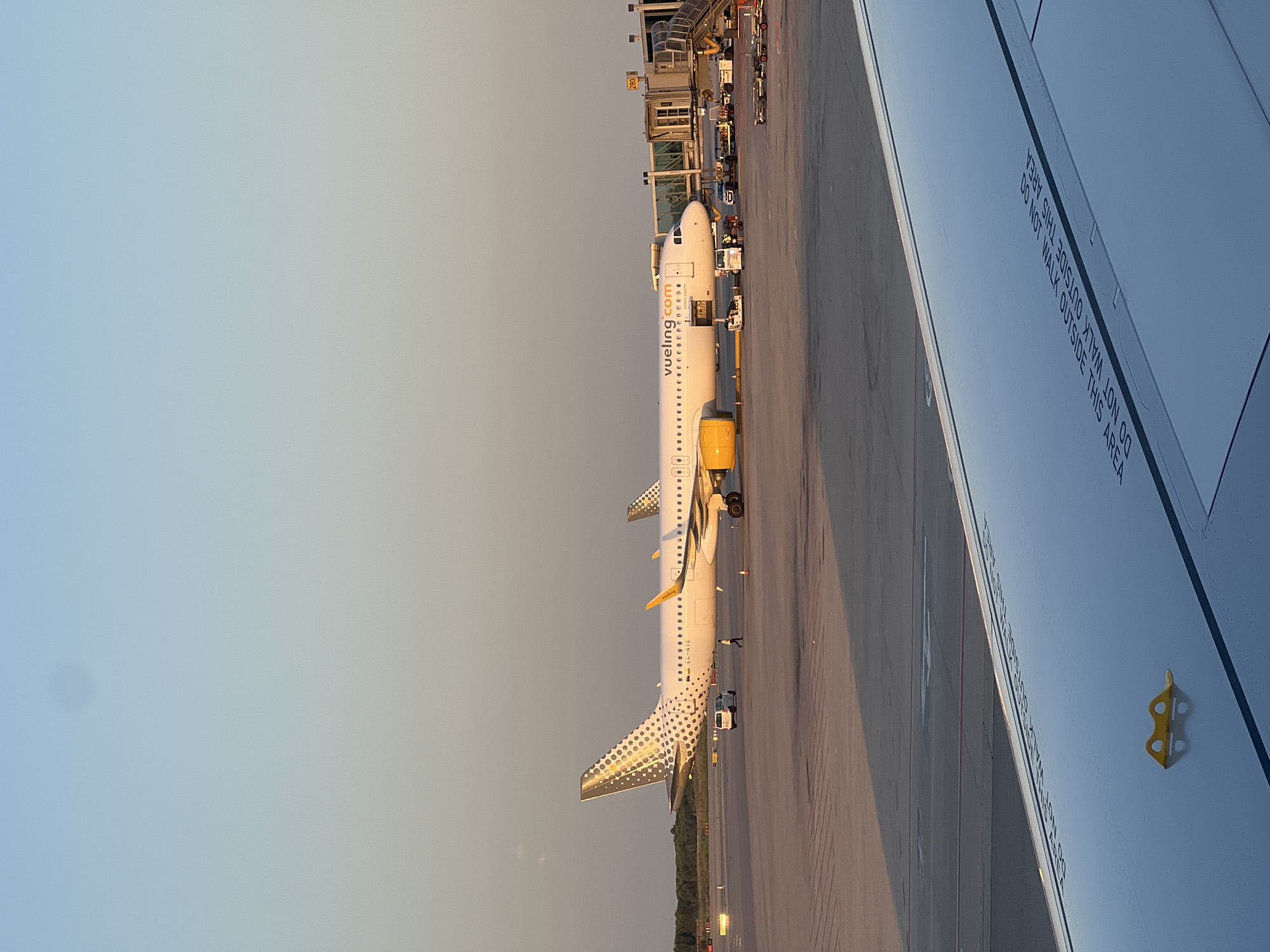 Evening scenes from Barcelona–El Prat Airport, planes at the gate