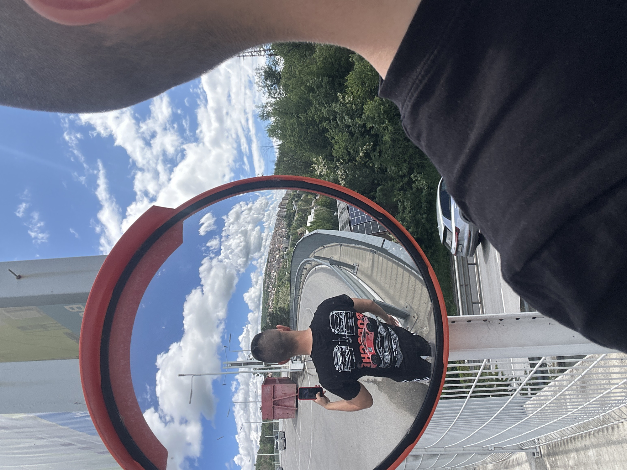 Tourist documents Veliko Tarnovo cityscape and mirror selfie