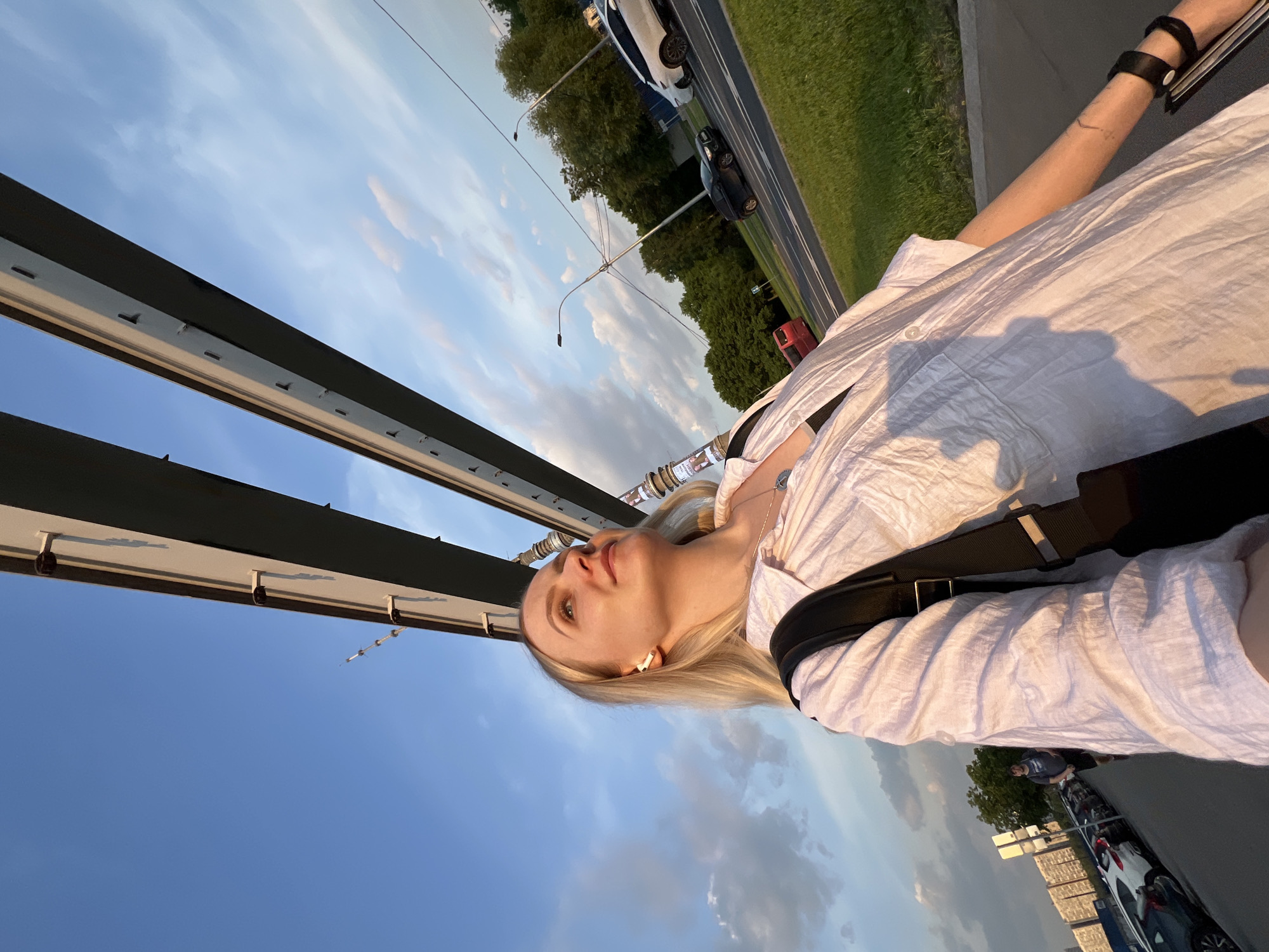 Woman pauses on Khimki bridge overlooking Moscow Canal