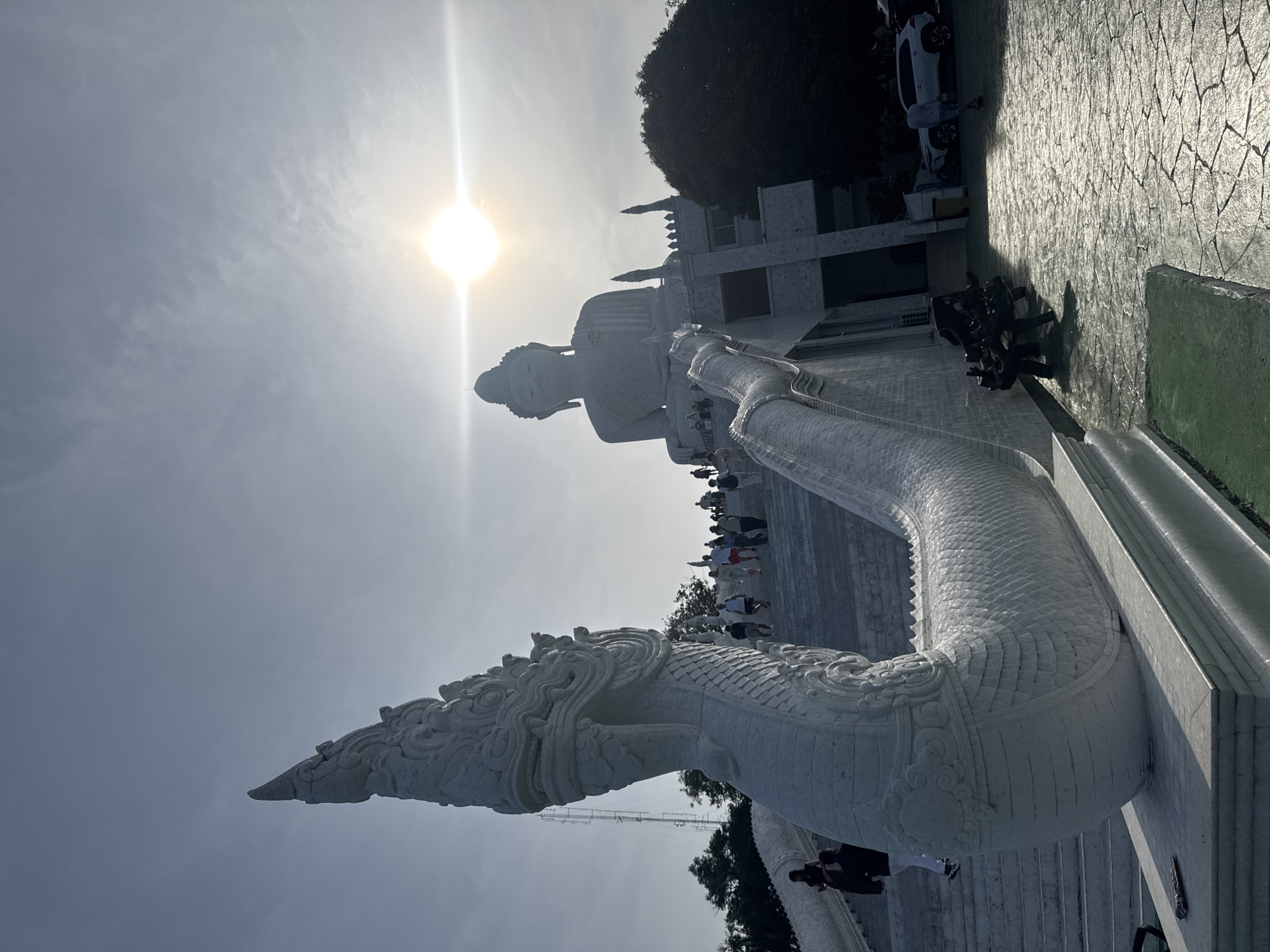 Tourists visit Great Buddha statue in Karon, Thailand