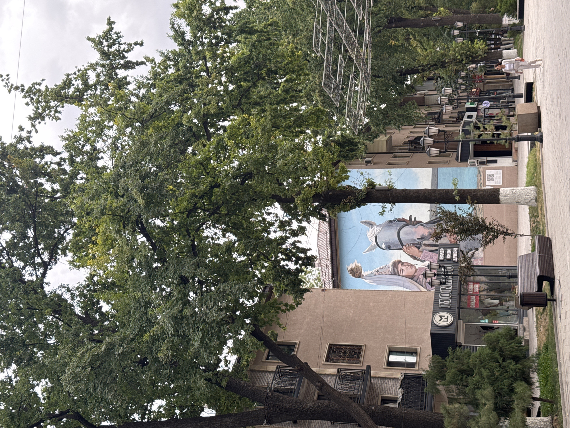 Shymkent's decorated pedestrian promenade on a July morning