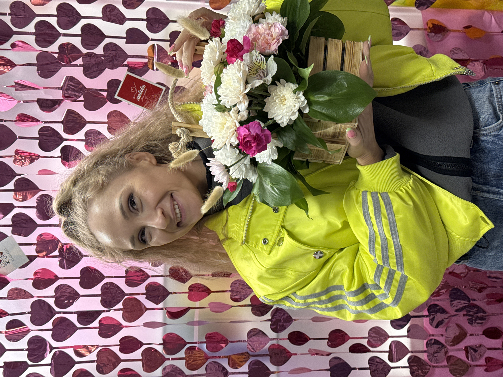 Woman displays flowers, wears floral headdress in Perm spring celebration