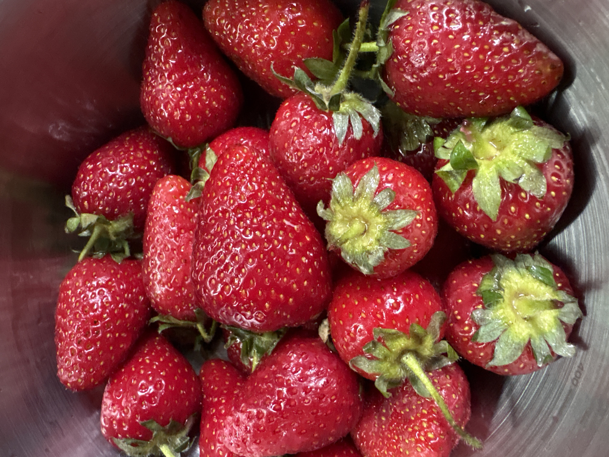 Memorial flowers and fresh strawberries observed in Chaika, Ukraine