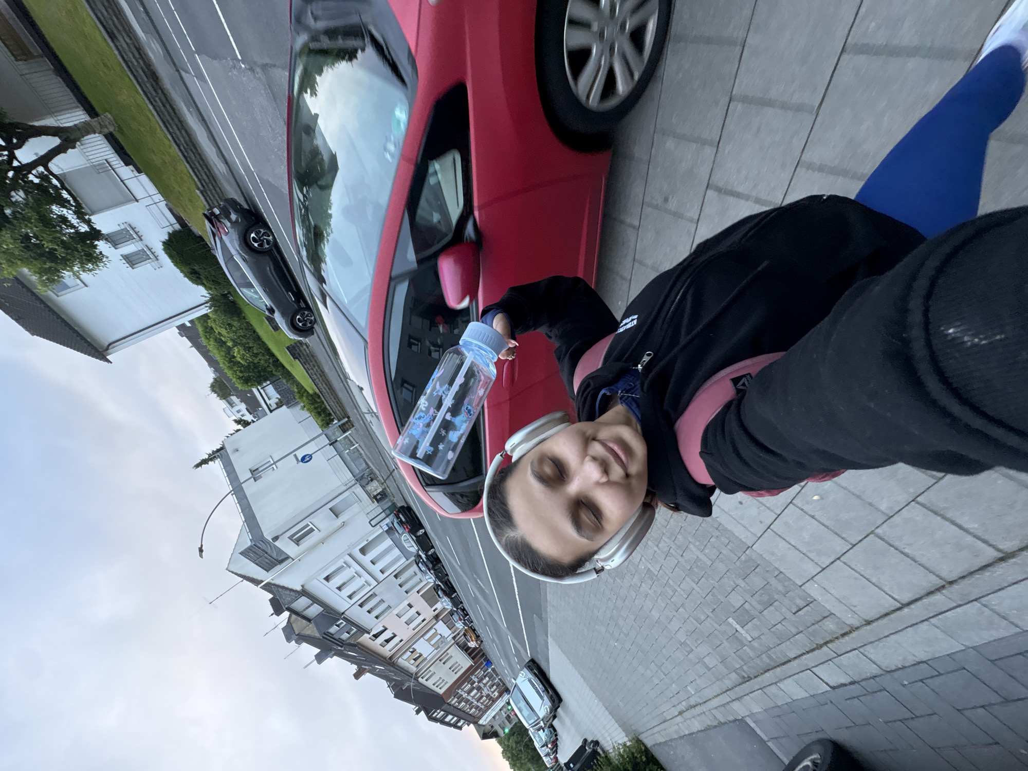 Woman takes early morning selfie on Mönchengladbach residential street