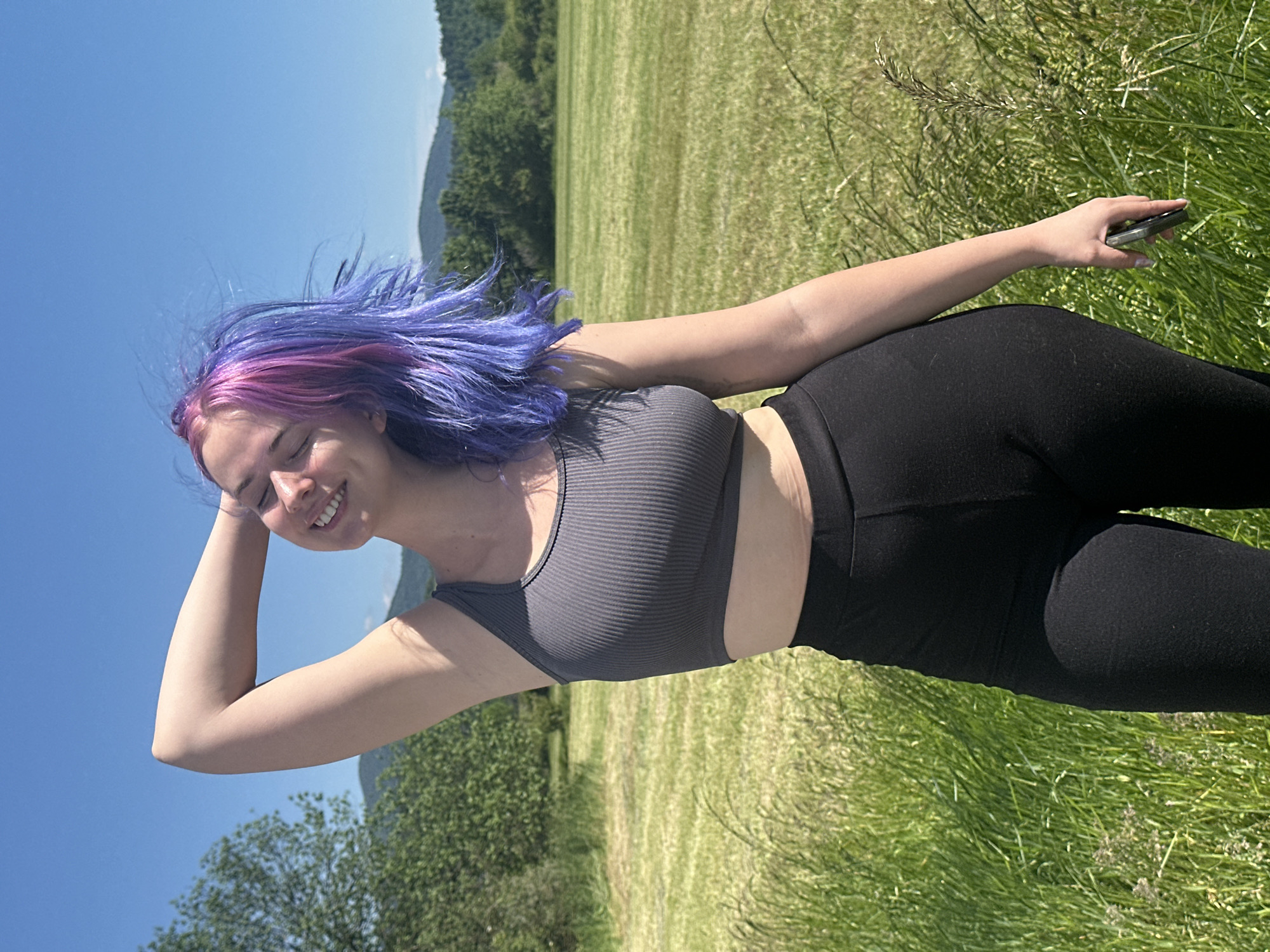 Woman with colorful hair photographed in Postojna field