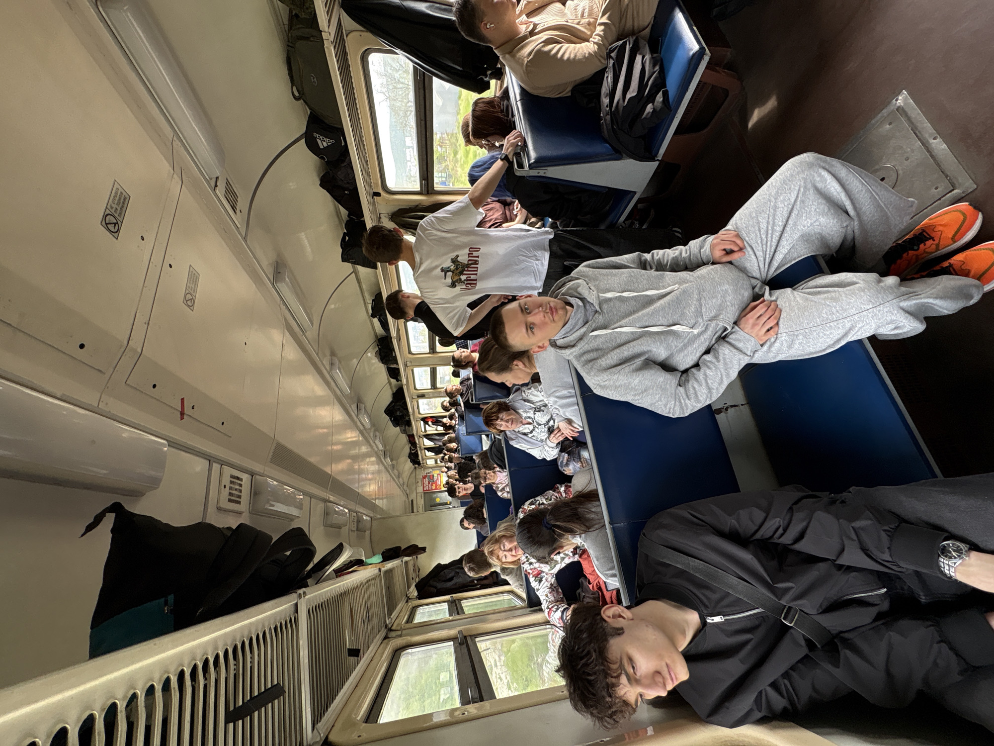 Train passengers observed during daytime journey in Kirillovka, Russia