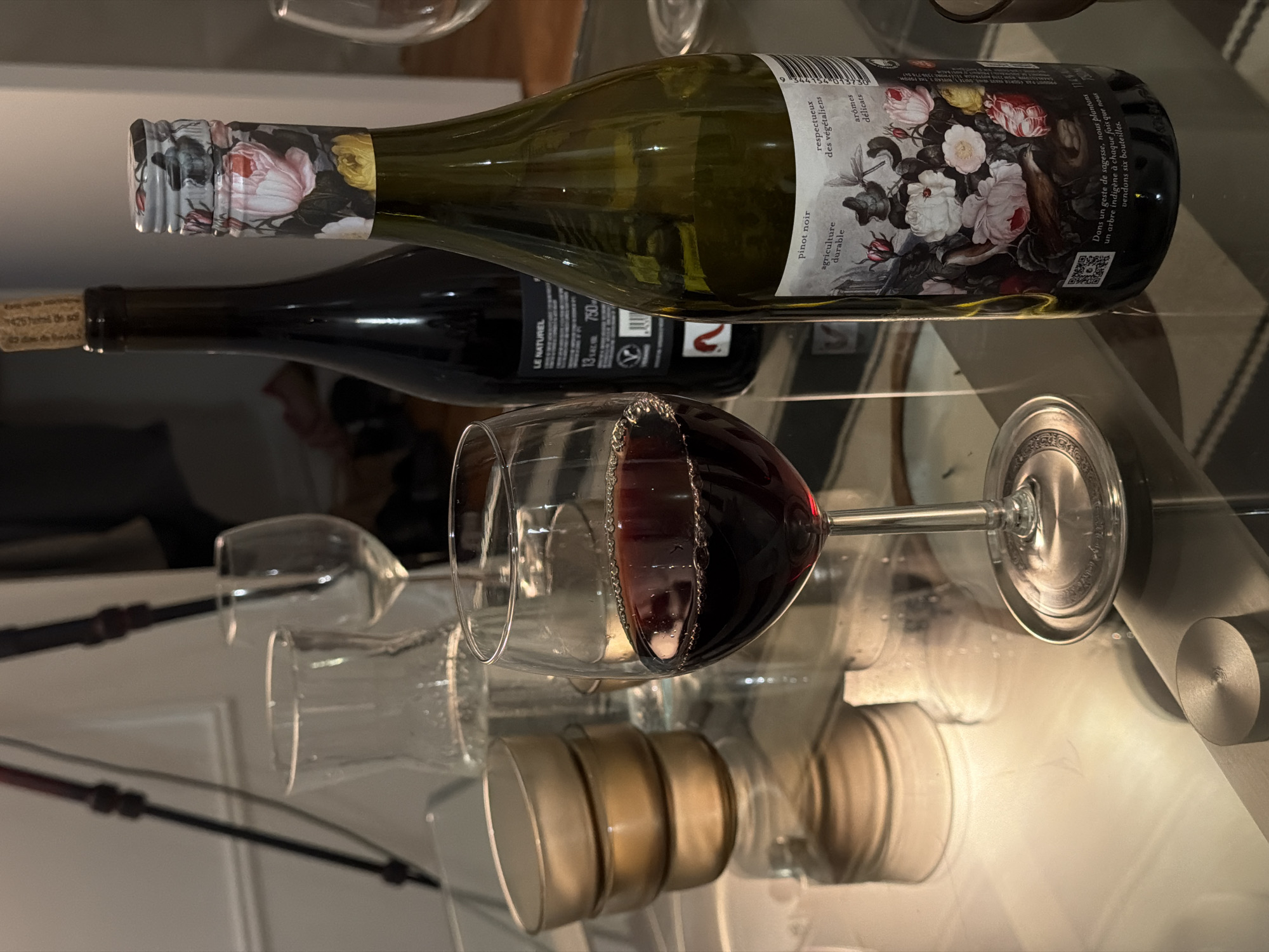 Person enjoys wine while taking smartphone selfies in Montreal