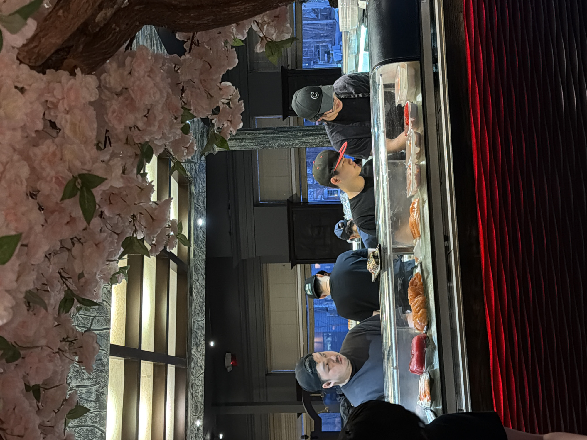 Sushi chefs prepare fresh rolls at Laval restaurant
