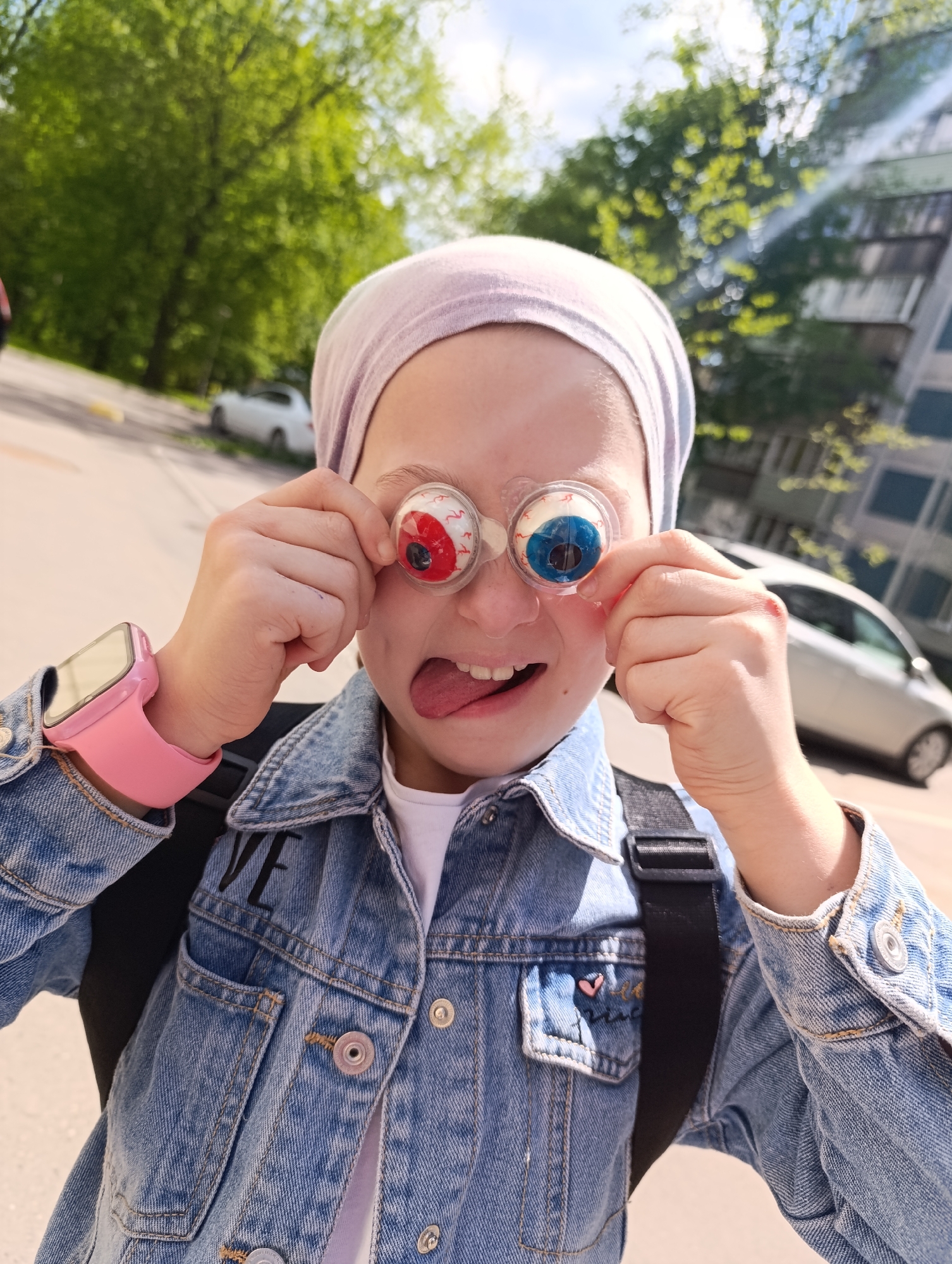 Urban moments: girl with novelty glasses, garden flowers, foraging pigeons