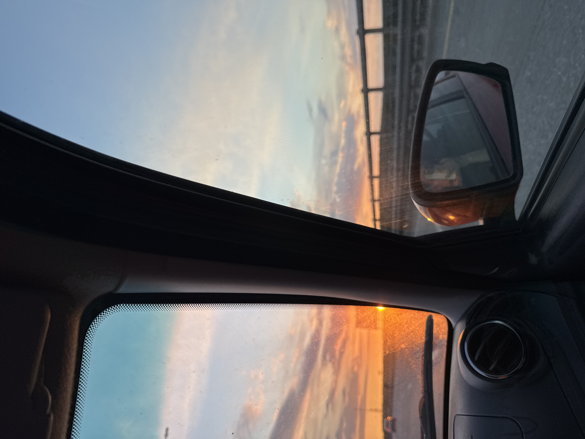 Vehicle passenger captures serene dawn or dusk in Perm