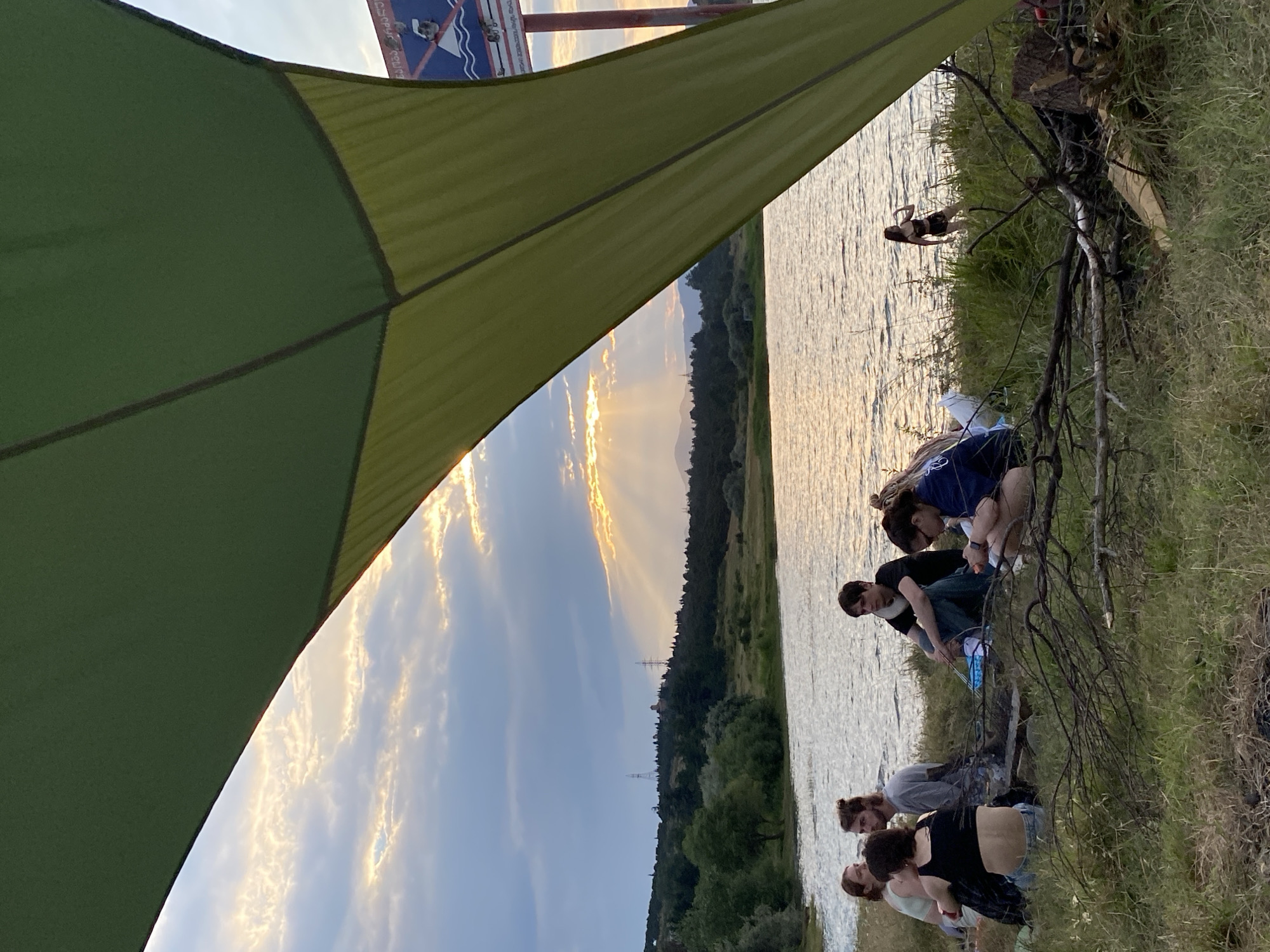 Picnic by the water in Tbilisi, stormy skies and pizza