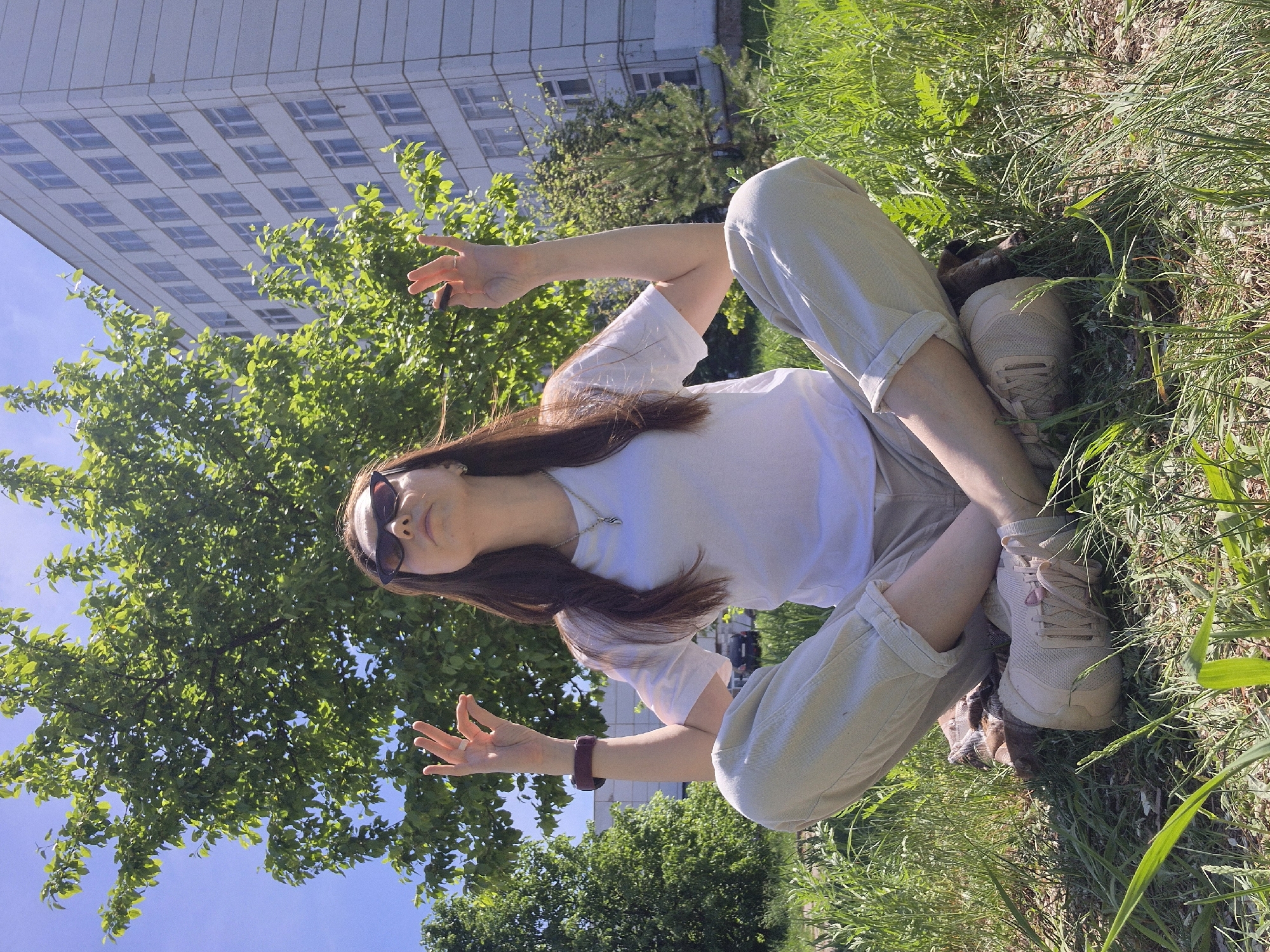 Woman enjoys morning yoga session in urban park setting