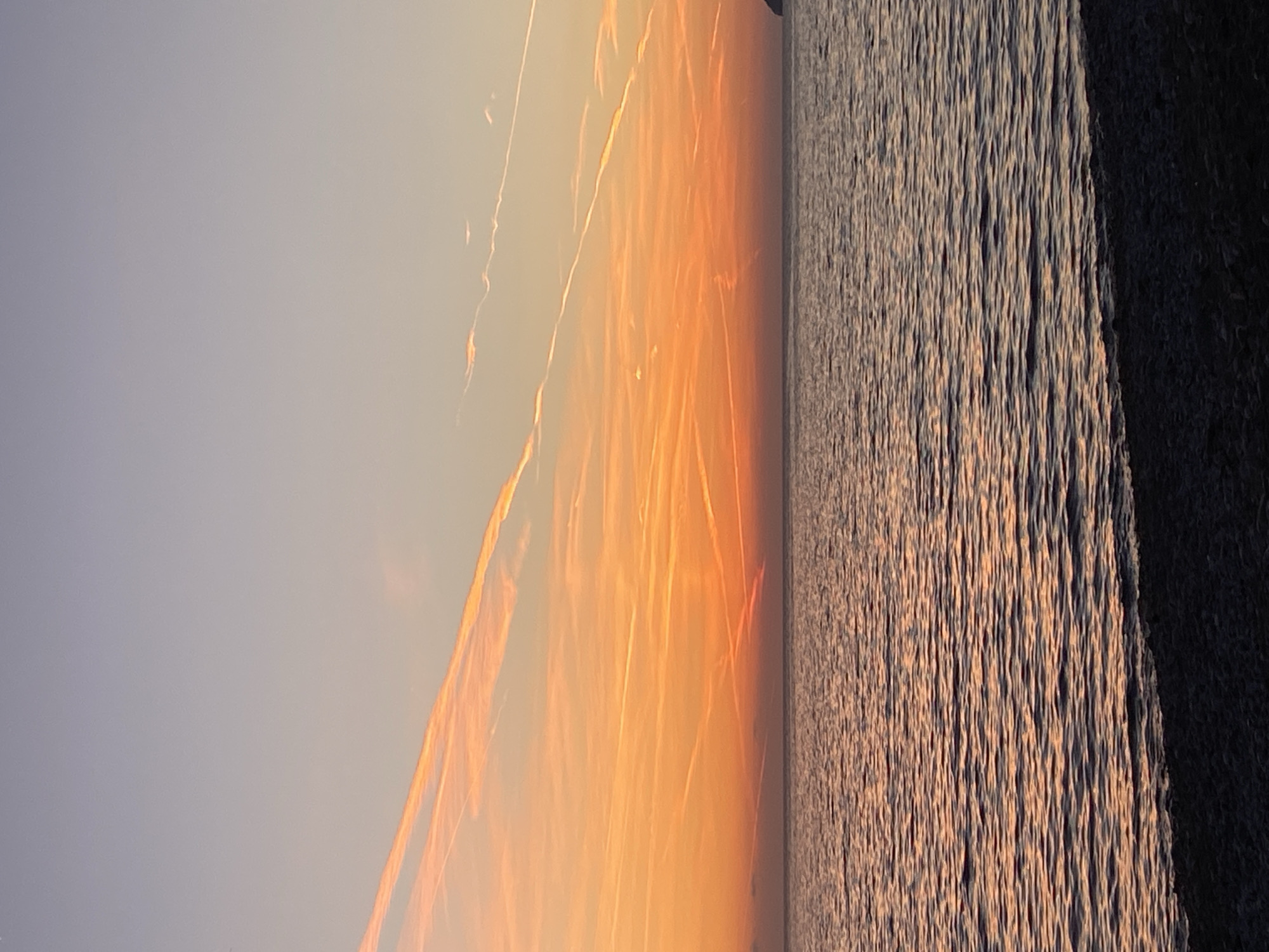 Young man walks waterfront paths during sunset in Bar, Montenegro