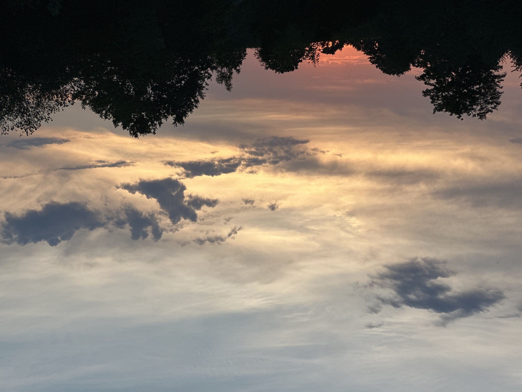 Sunset and still water at the edge of Halfing