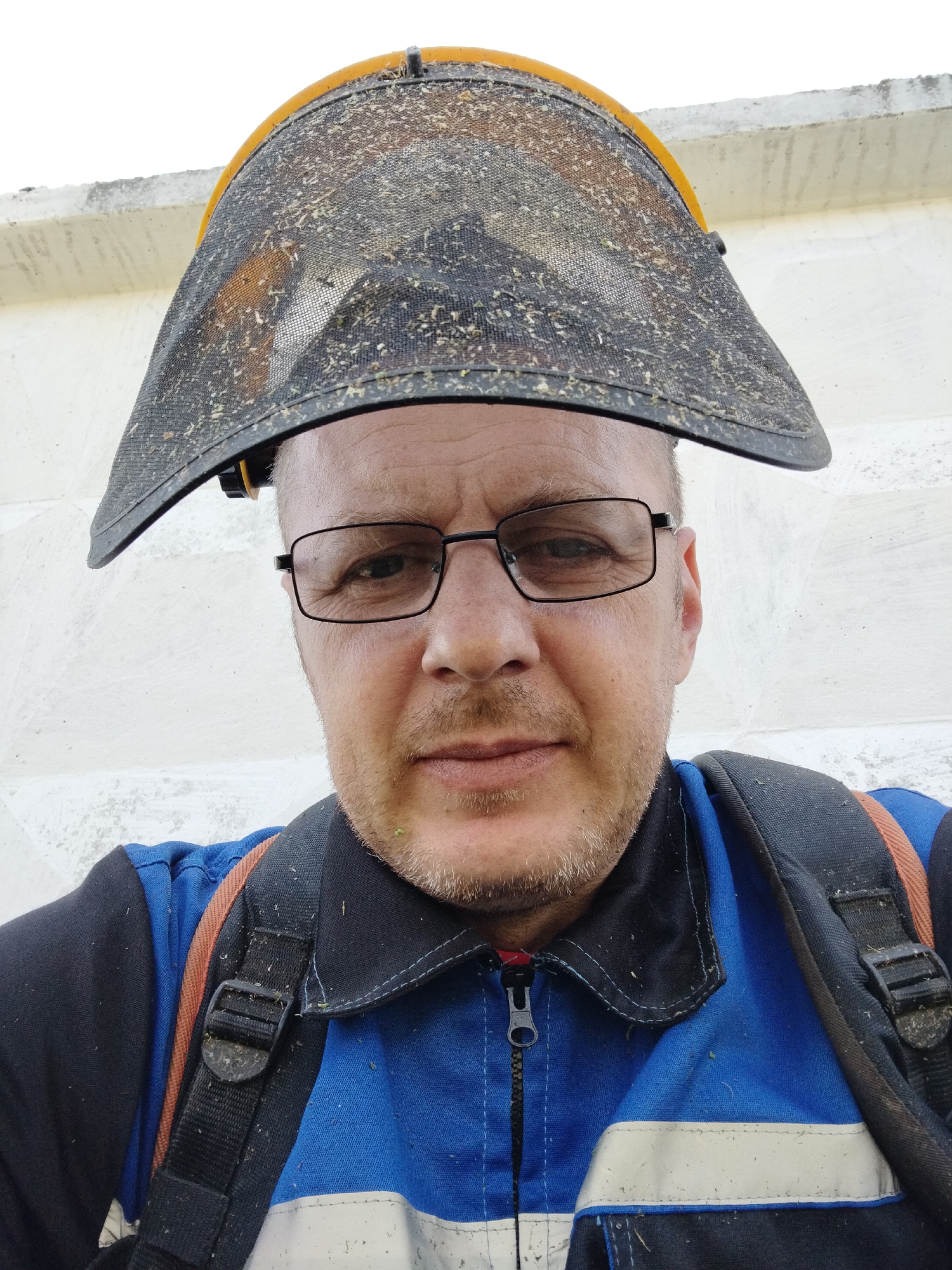 Outdoor work gear and ground-level grass, rural Belarus