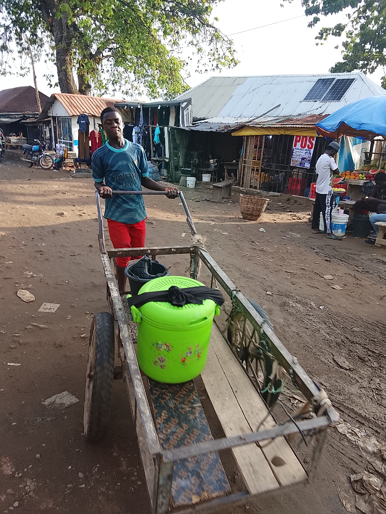 Daily market life captured on muddy Abuja streets