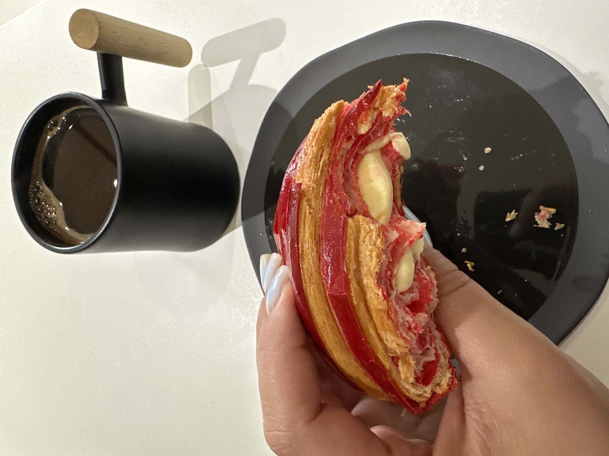 Morning pastry consumption documented in Tbilisi breakfast setting