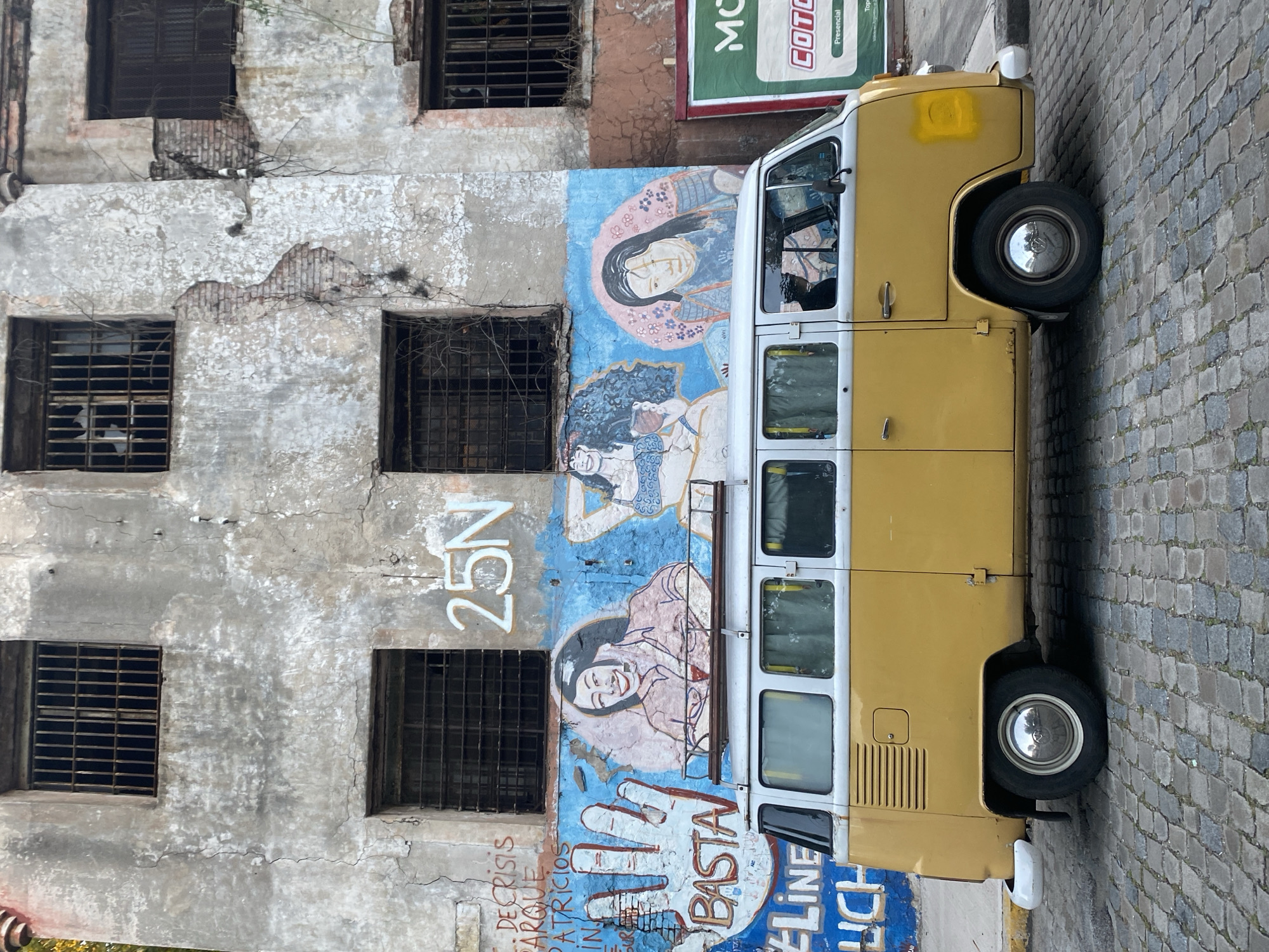 Volkswagen van parked near decaying building in Buenos Aires