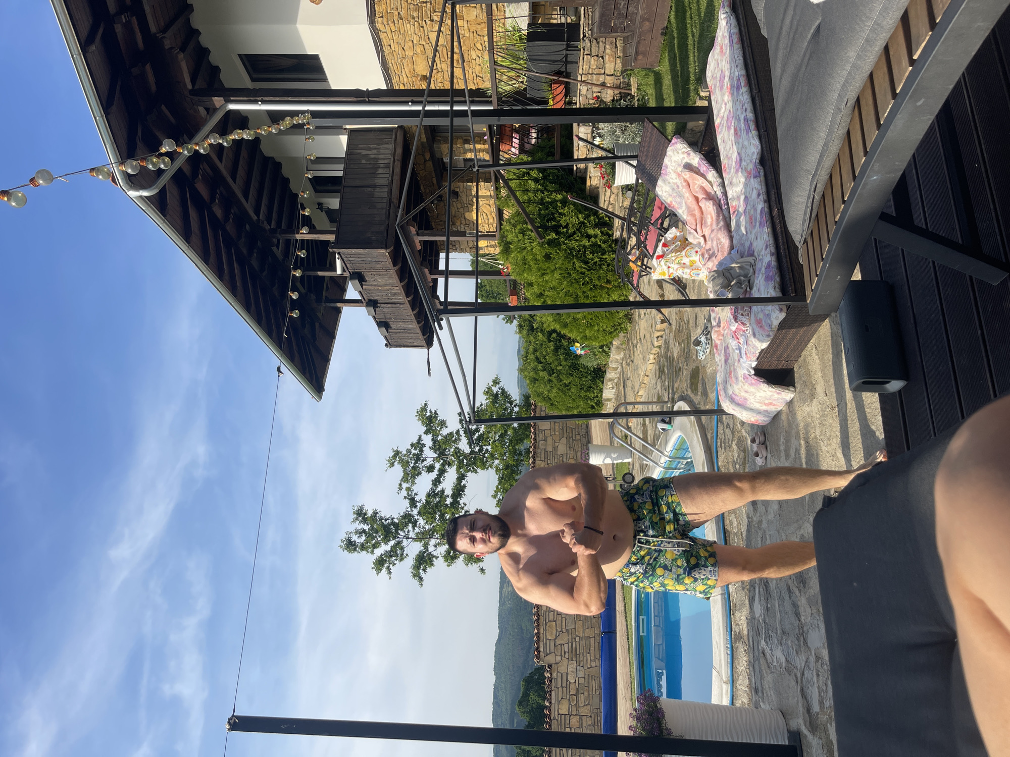 Man flexes poolside at Bulgarian residence