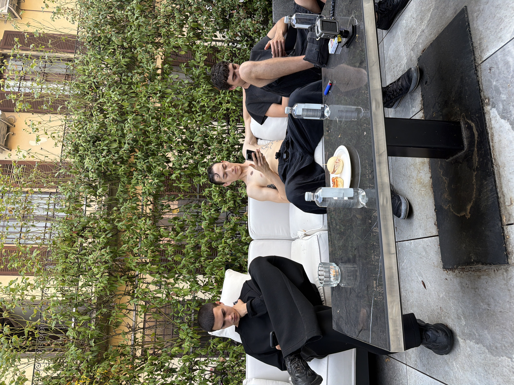 Patio hangout in Milan, marble table and matching fits