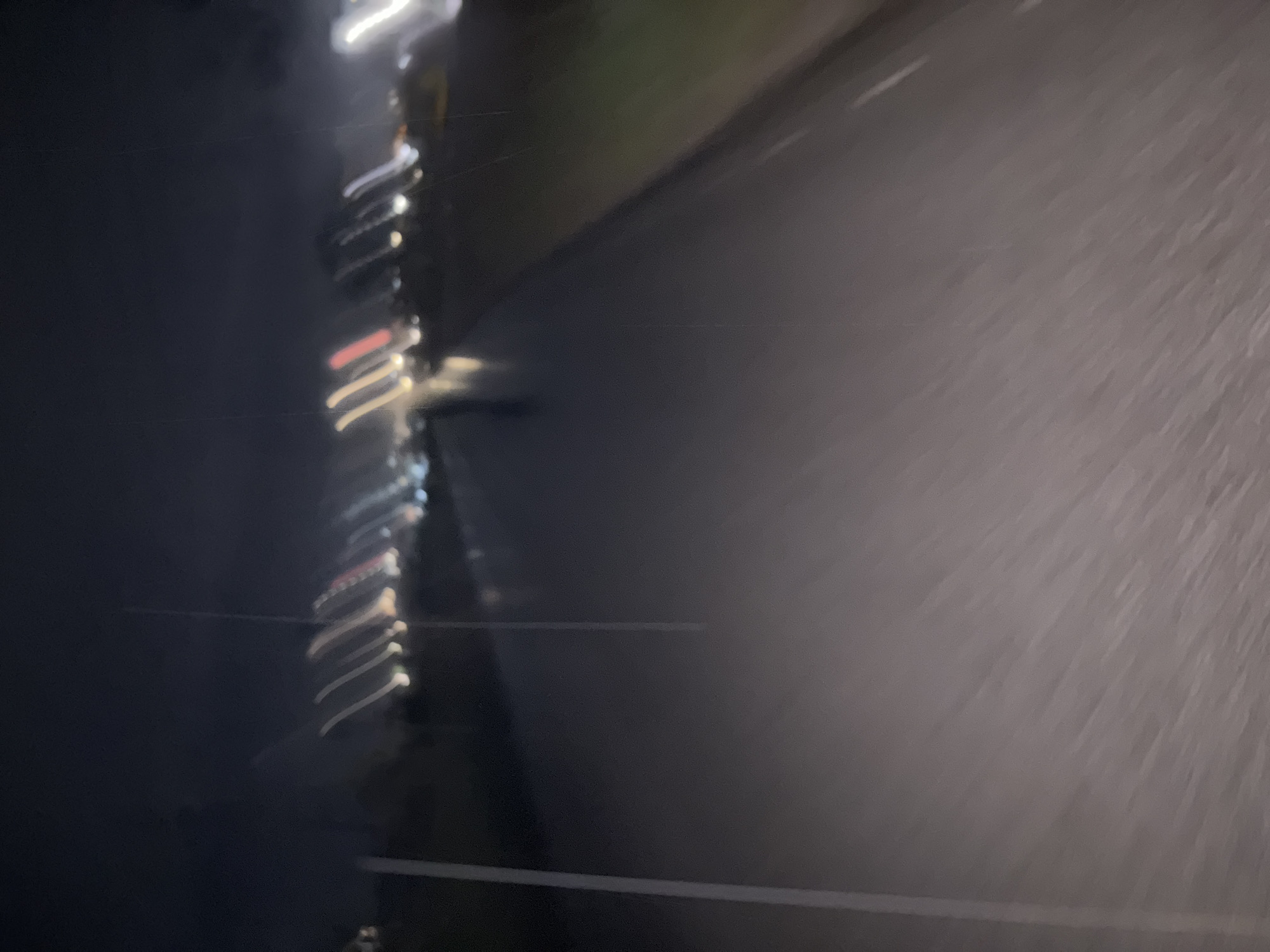 Blurred night lights captured from moving vehicle in Karlovo