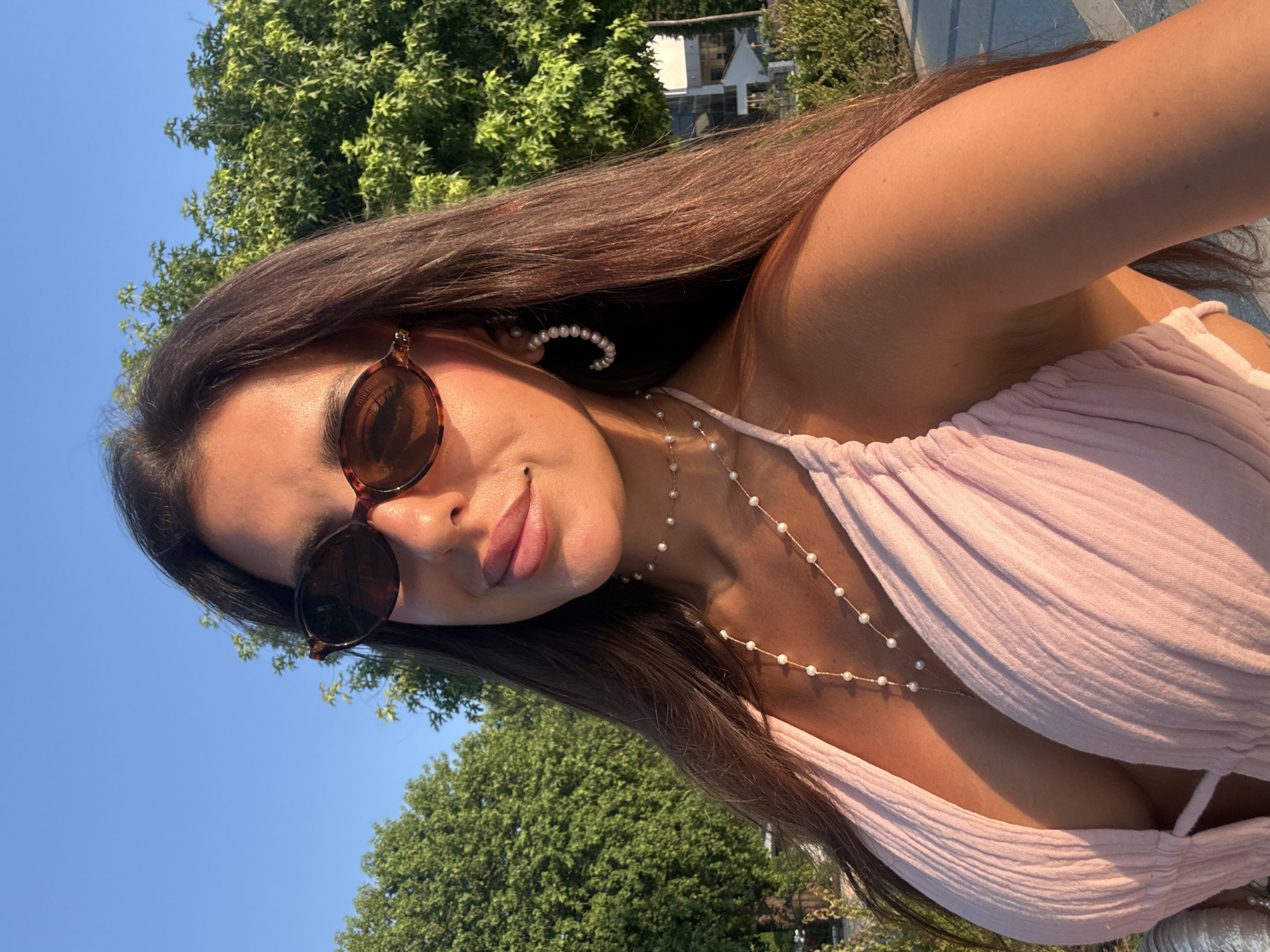 Sunset stroll along Fethiye harbor, pink dress and golden hour
