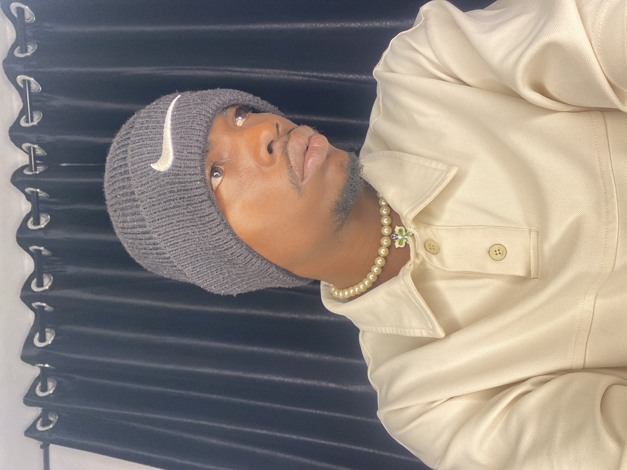 Portrait session in Abakaliki, Nigeria: Nike beanie and pearl necklace
