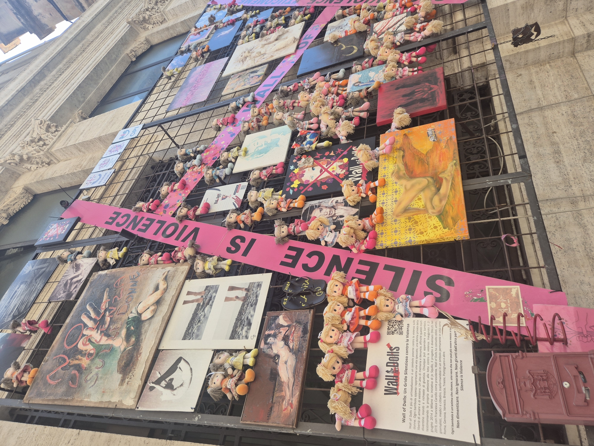 Wall of Dolls art installation documented in Genoa
