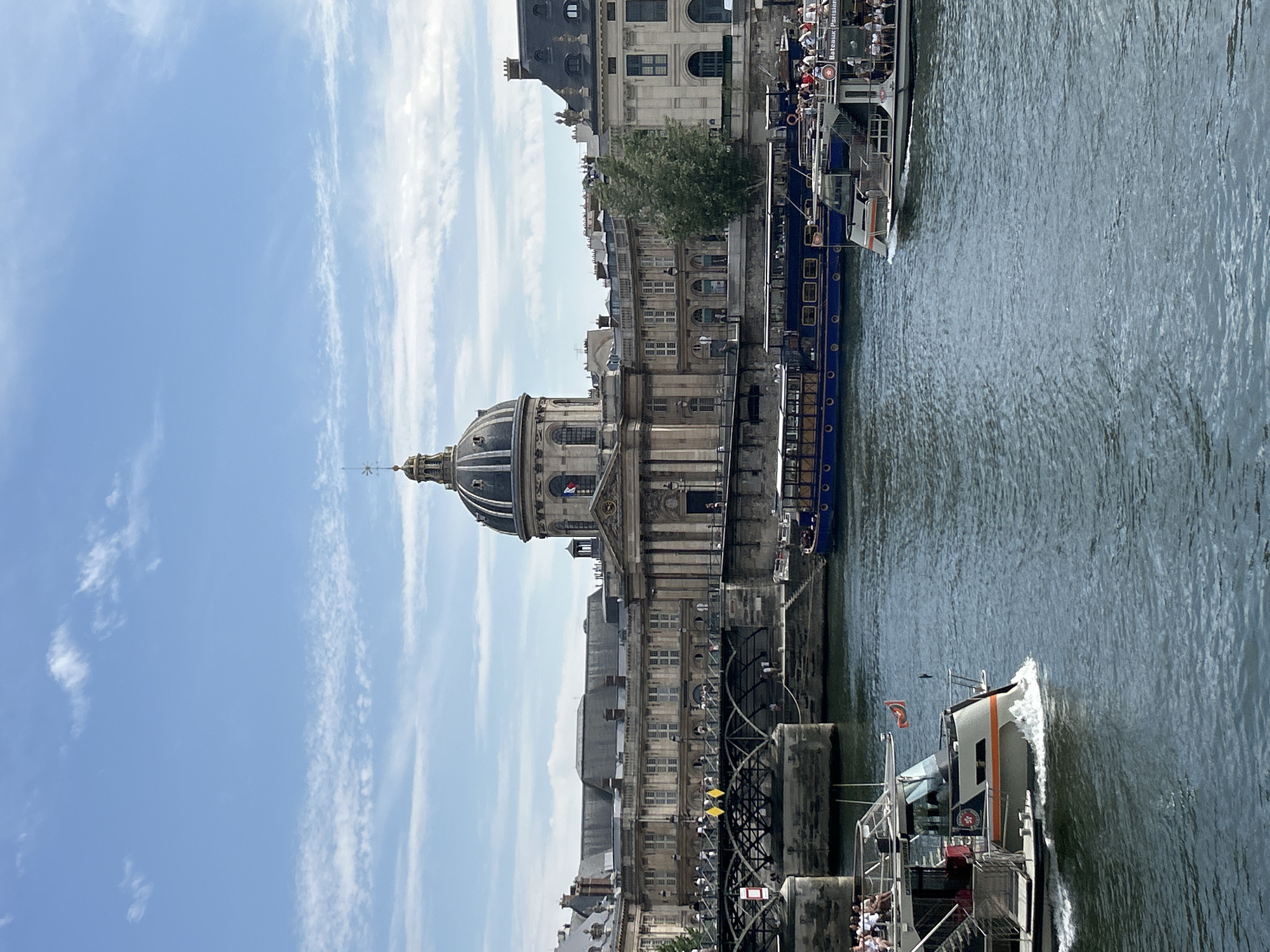 Tour boats on the Seine, Paris landmarks in the background
