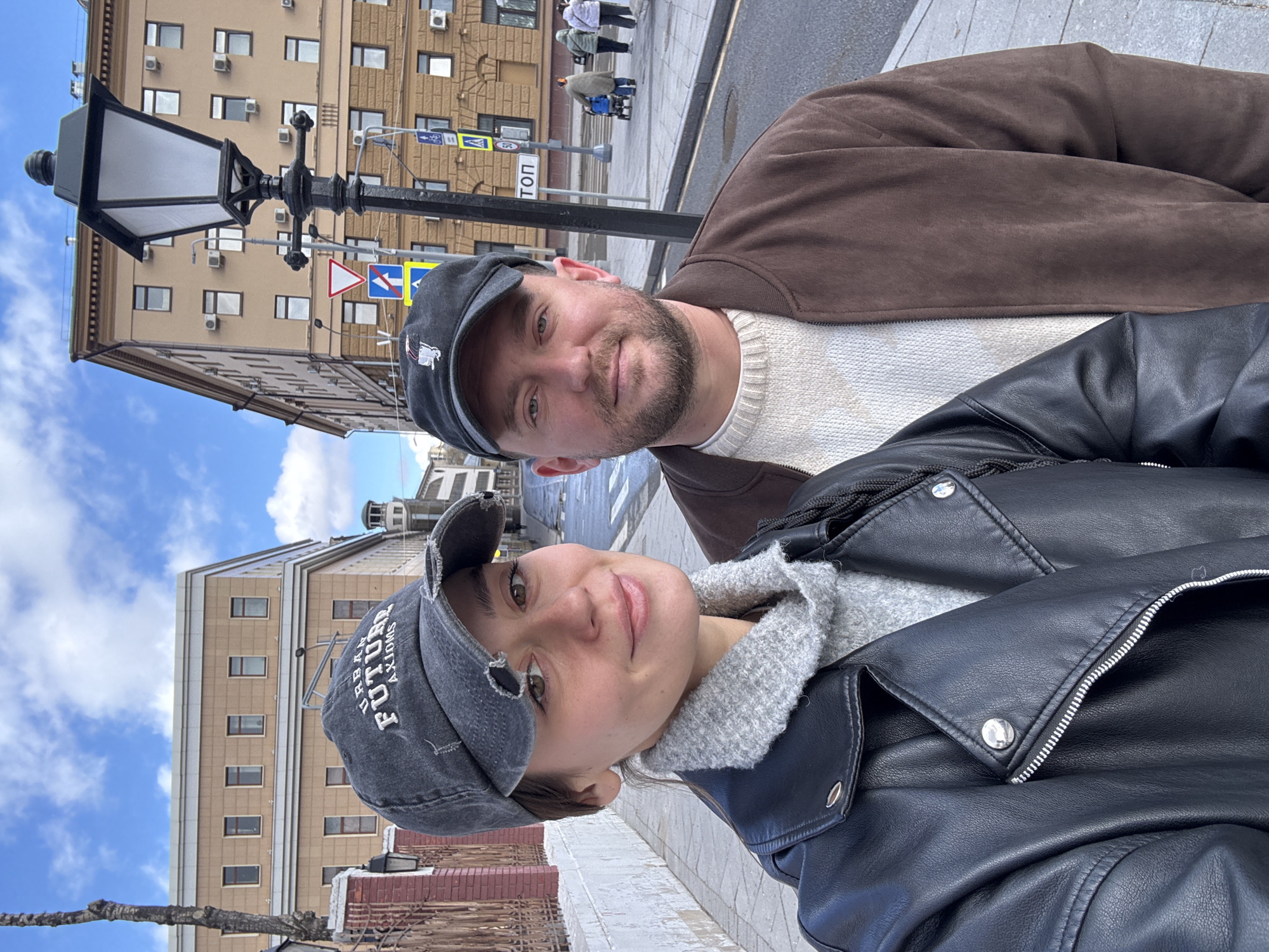 Tourists photograph themselves near historic Moscow building