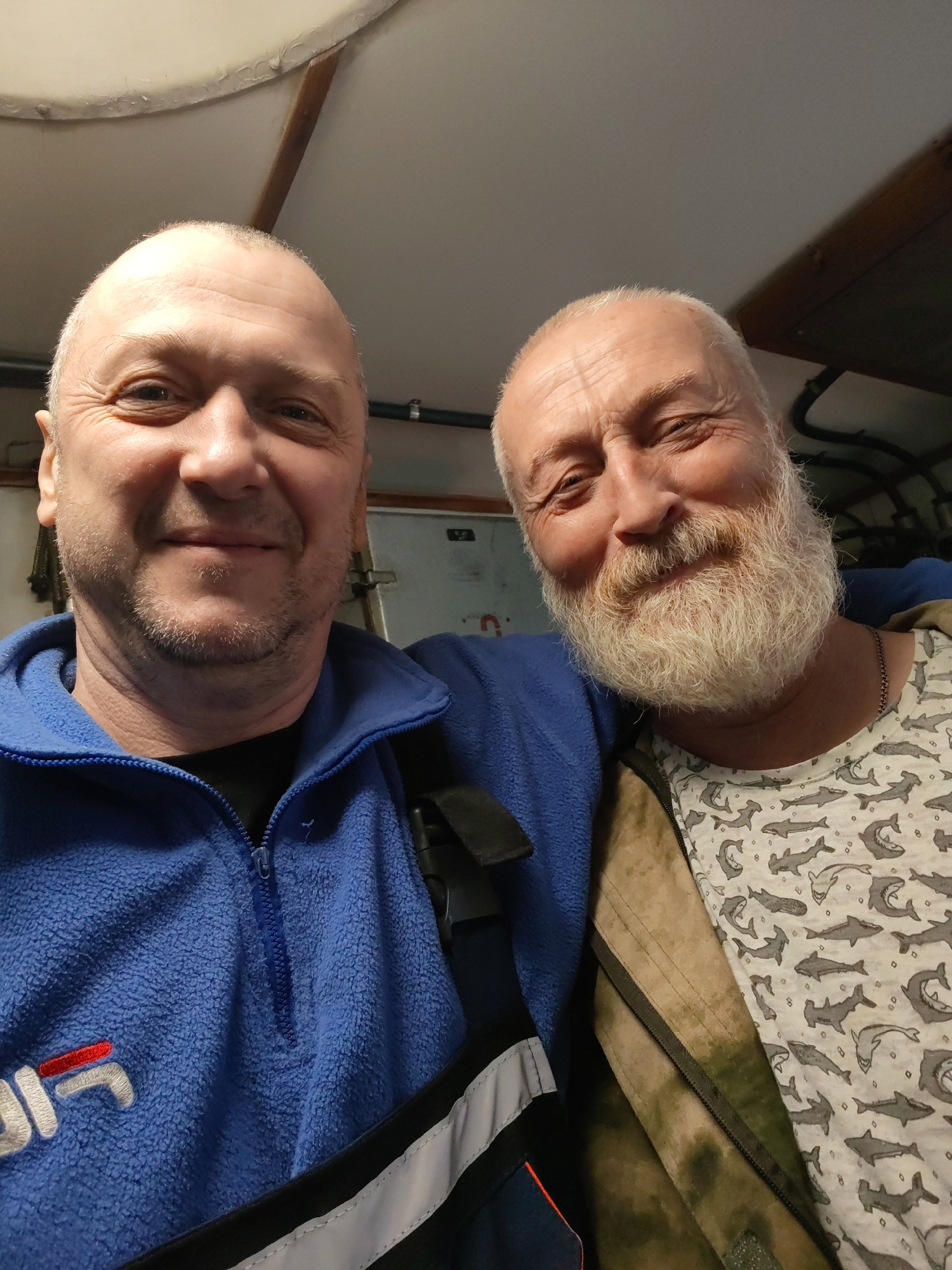Two friends capture indoor selfie moment