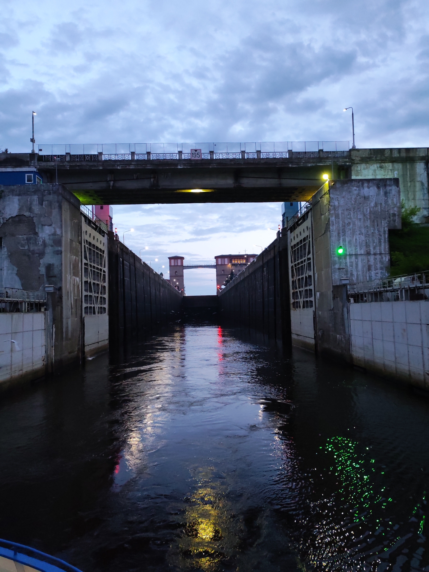 River cruise ships navigate the Bol'shie Mkhi lock at dusk