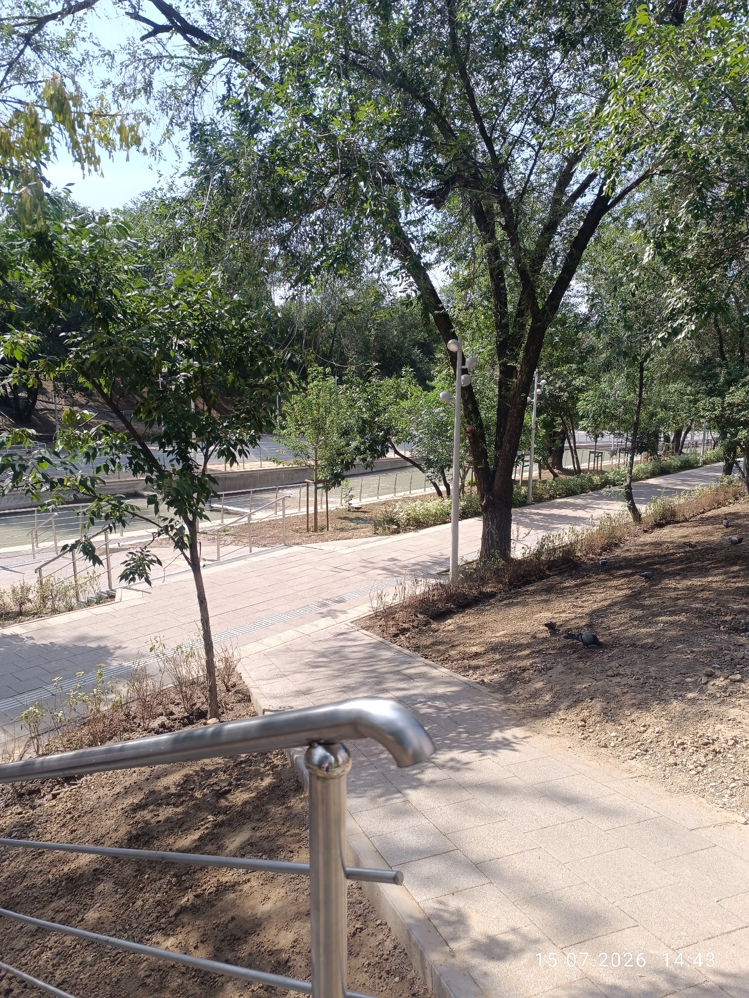 Park paths, apartment towers, and street-side moments in Almaty