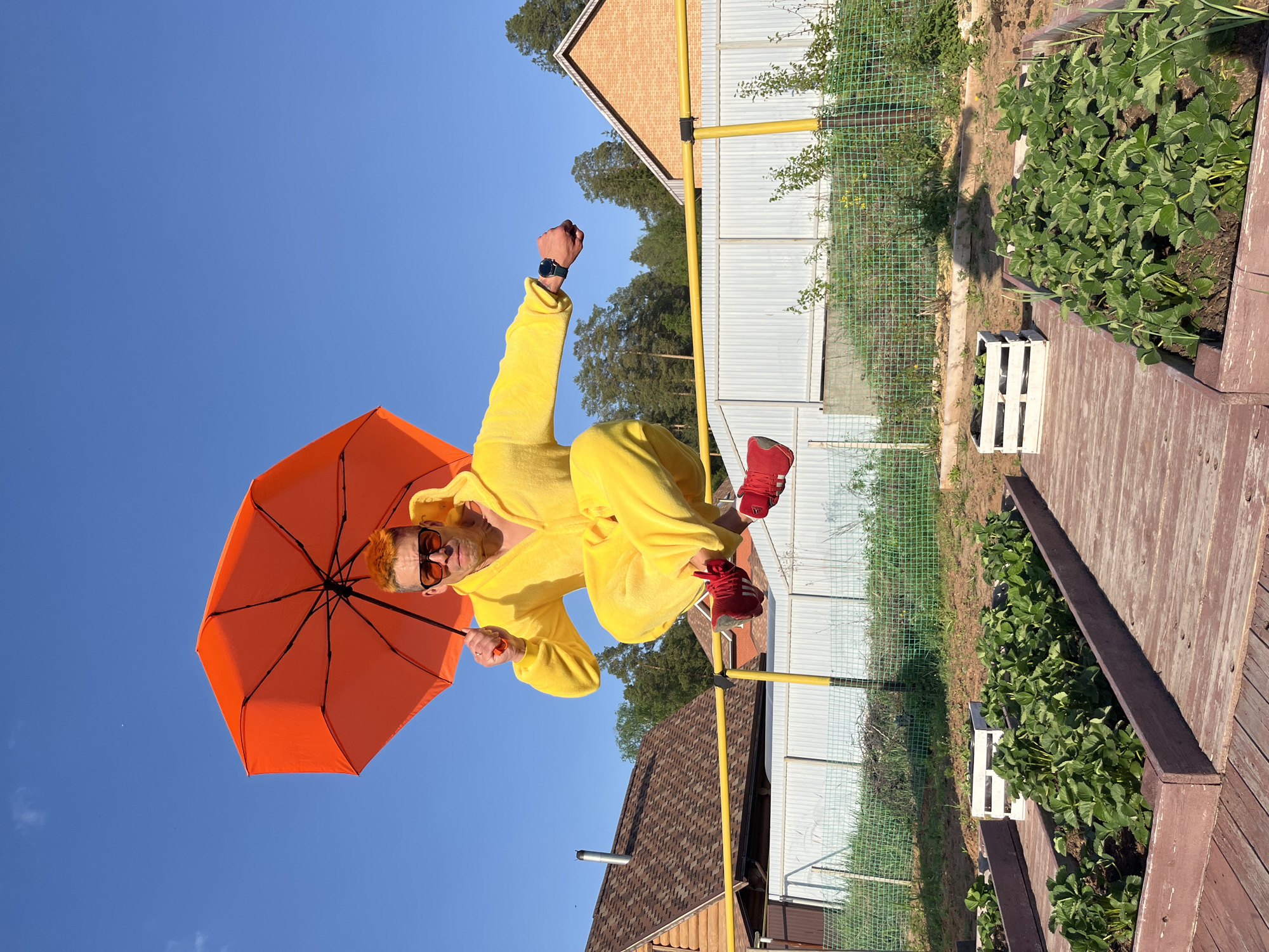 Person in Pikachu costume performs aerial stunts in Russian backyard