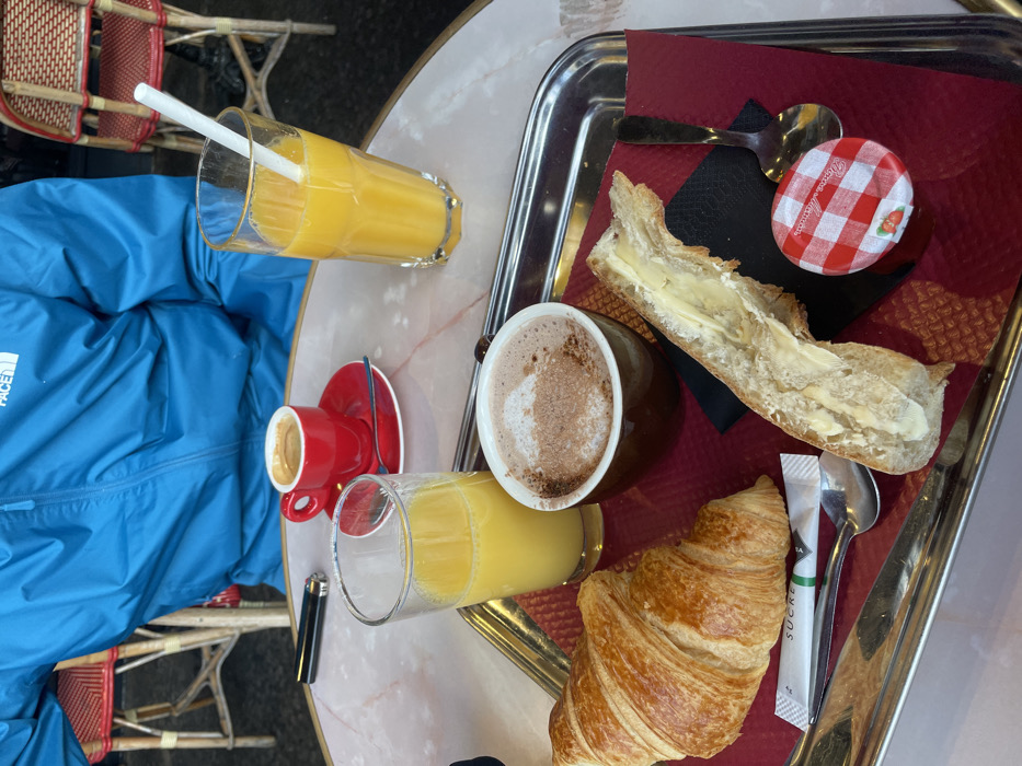 Morning café scene captured at Paris outdoor restaurant