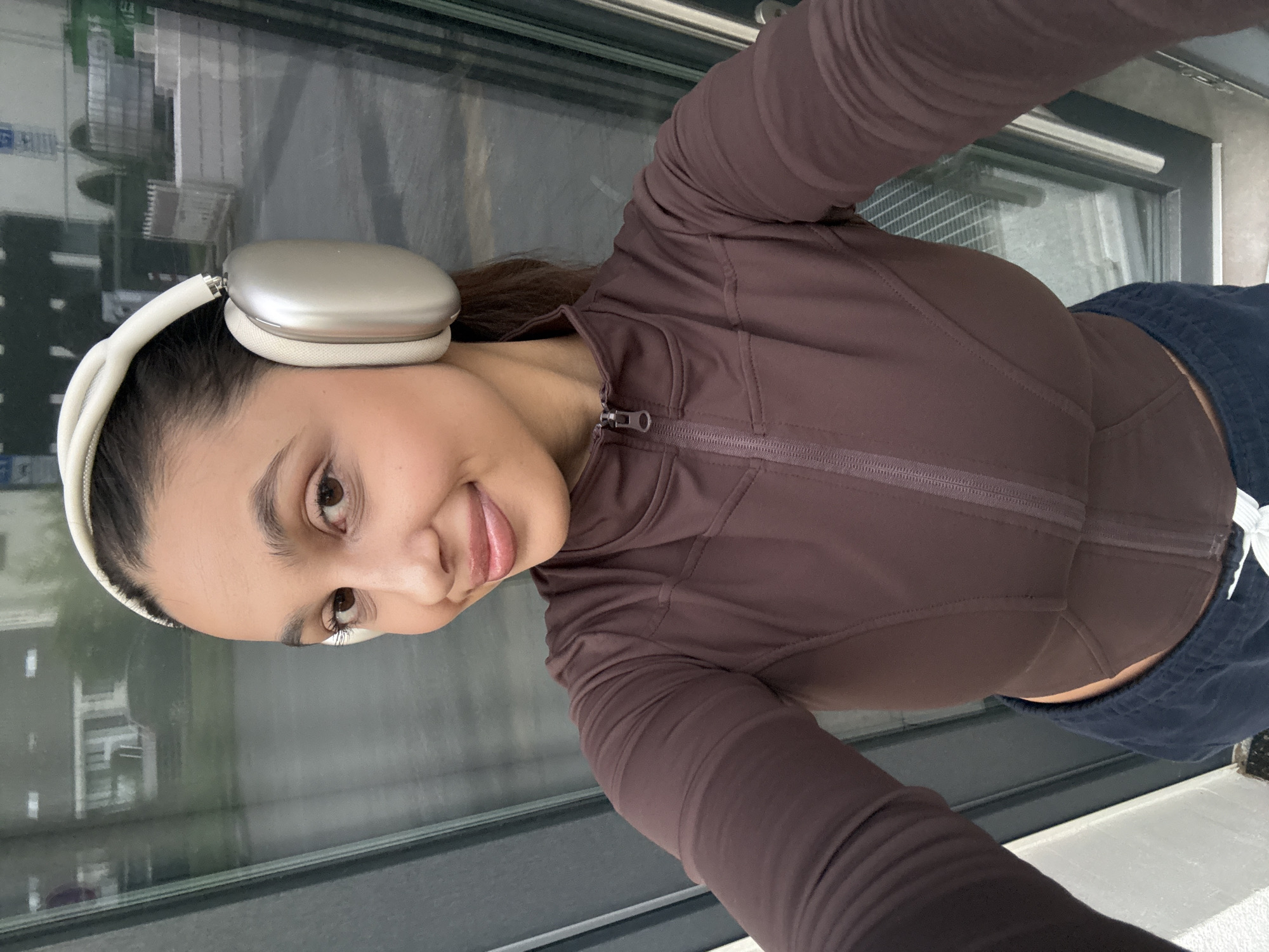 Woman takes selfie session in brown athletic wear, Mönchengladbach