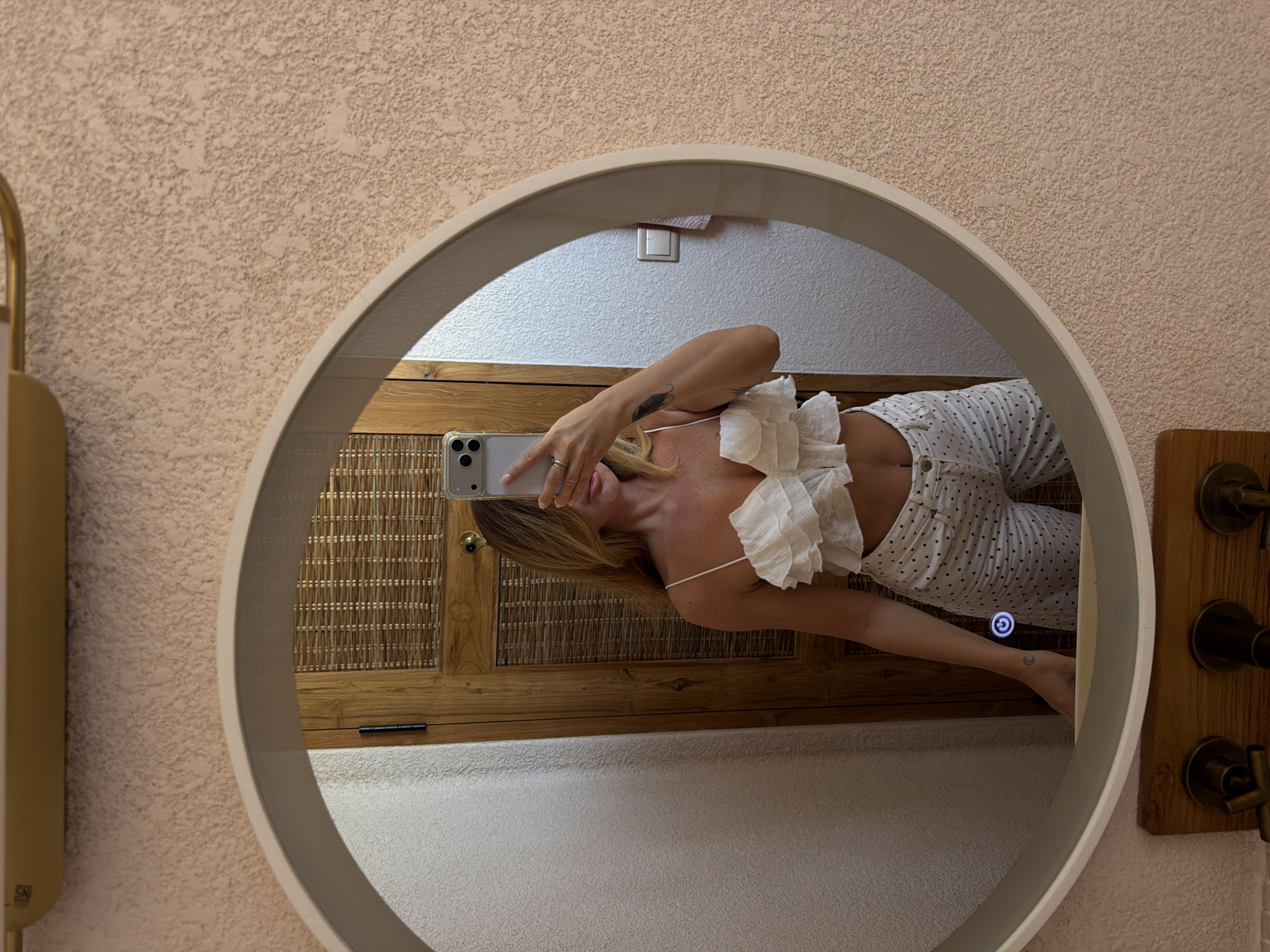Woman takes mirror selfies in Mengwi, Indonesia