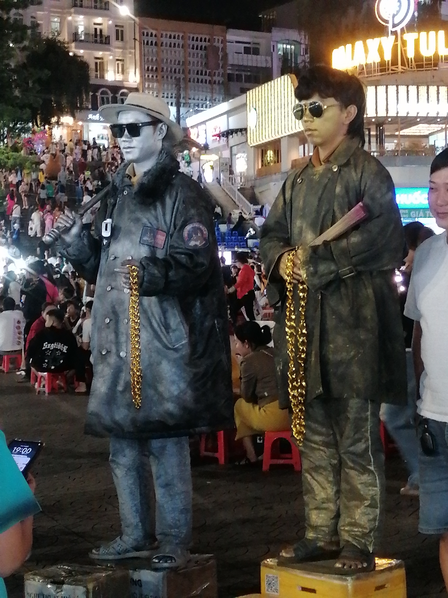 Costumed street performers entertain crowds at Da Lat night market