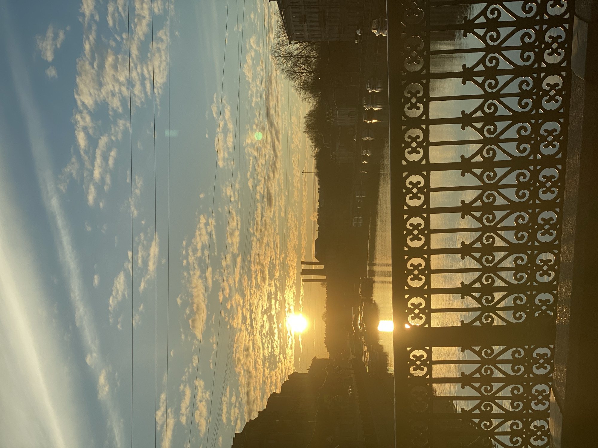 Golden hour sunrise illuminates Saint Petersburg canals and architecture
