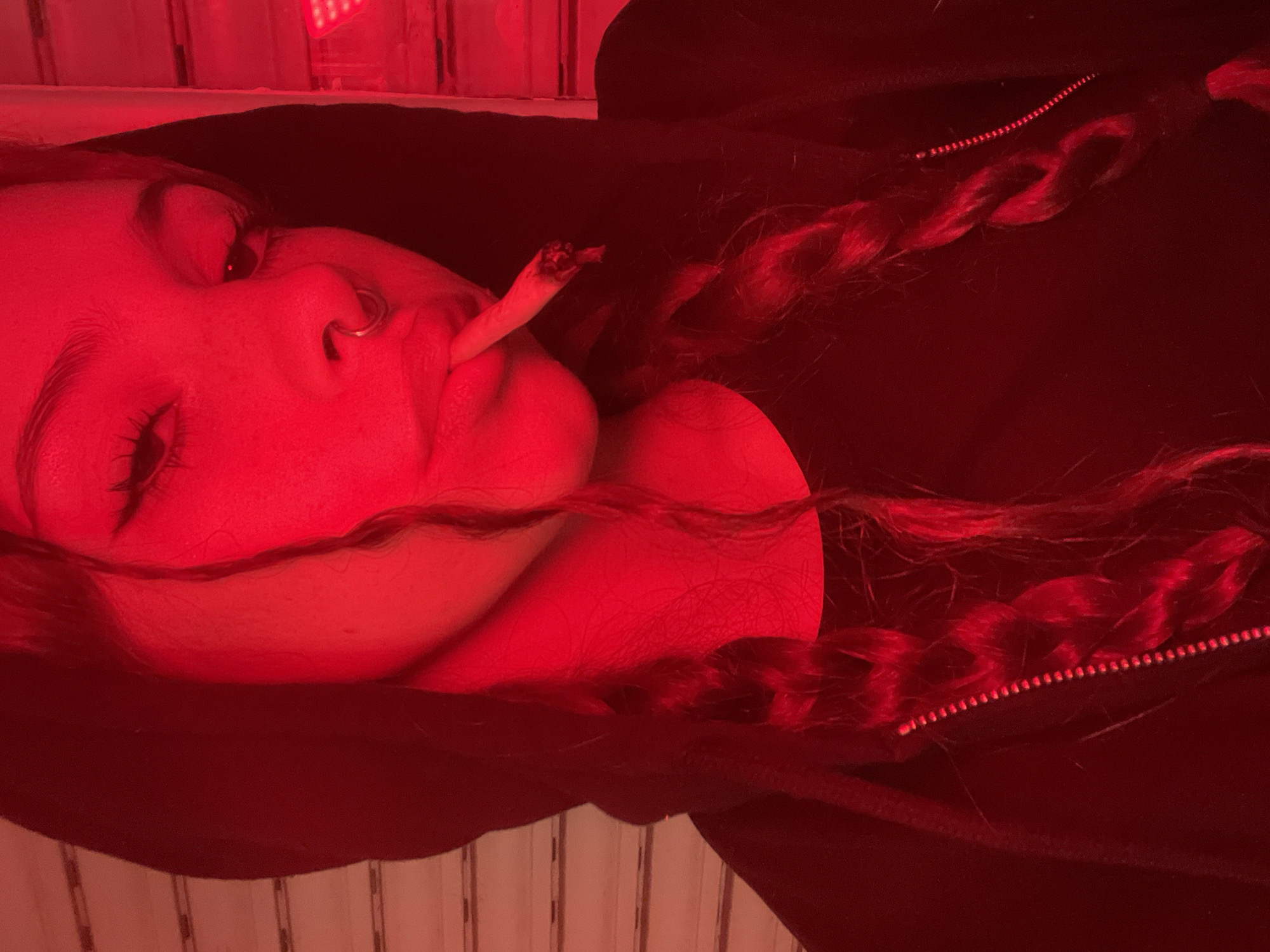 Woman spotted smoking cigarette while lying down in Buenos Aires