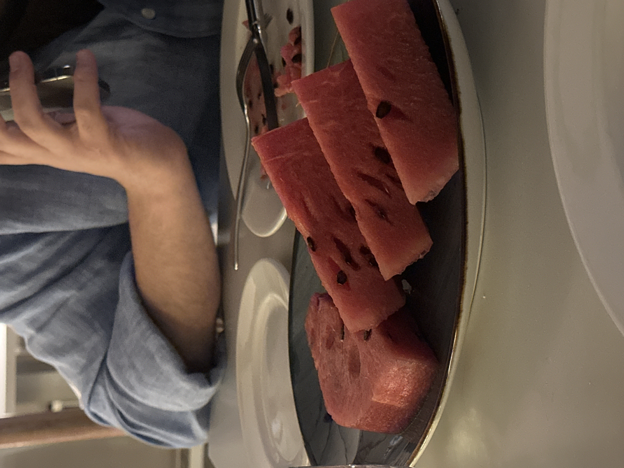 Evening moments captured in Yerevan: watermelon serving and cinema facade