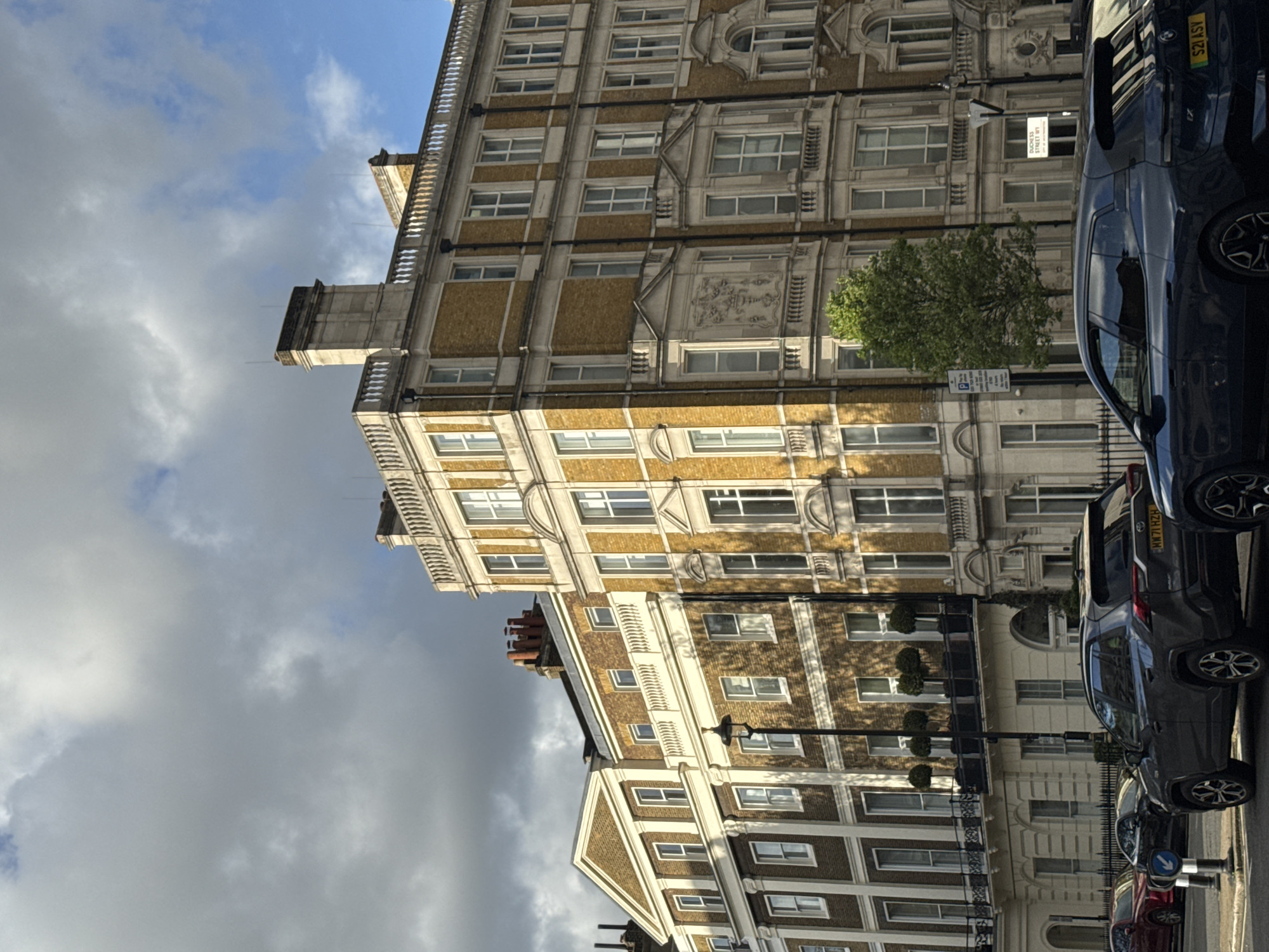 London street scene captured showing typical buildings under cloudy skies