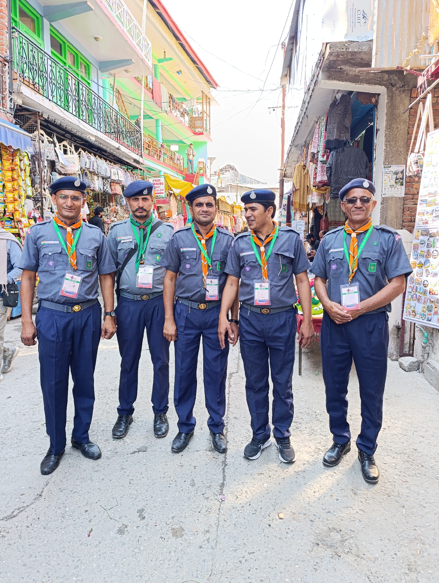 Uniformed men pose for photos on Vashisht street