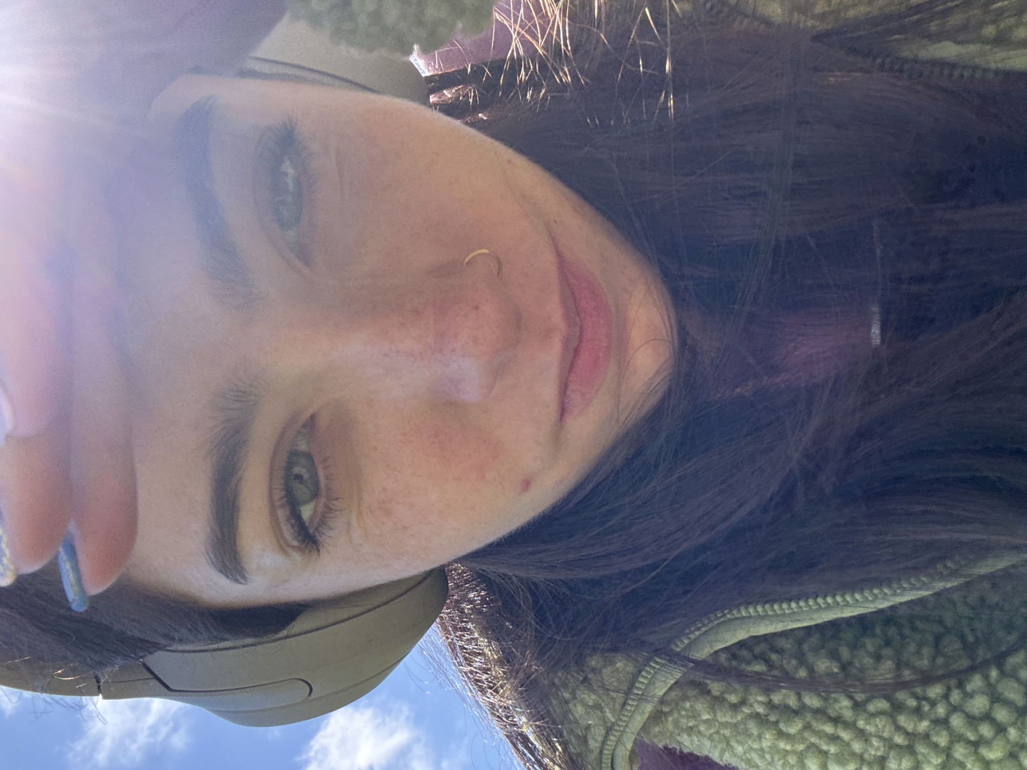 Woman takes selfie in Hull park among spring flowers