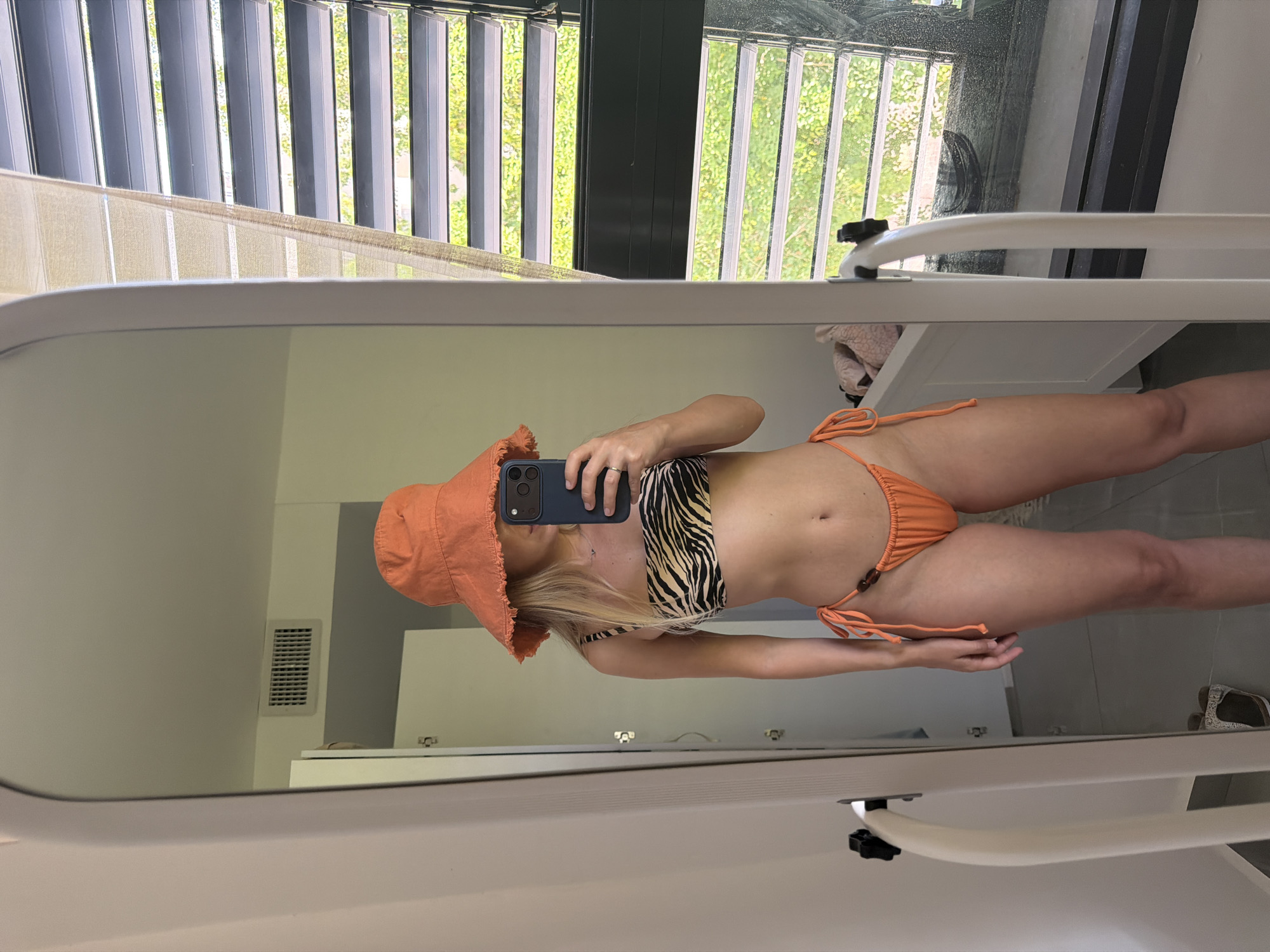 Mirror selfie in Bat Yam, Israel, zebra-print bikini and bucket hat