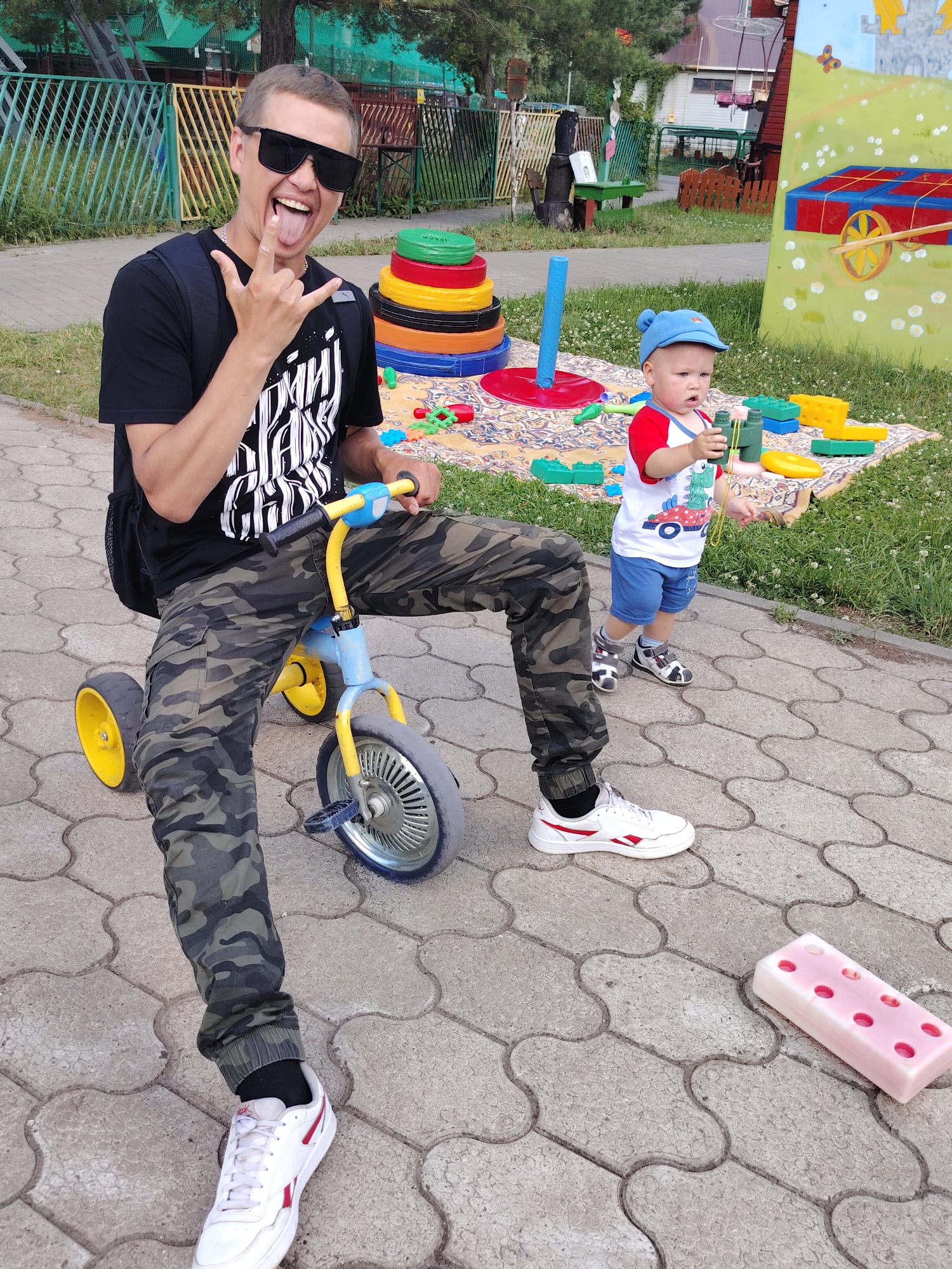 Summer day out at a Chaikovsky fairground, river in the background