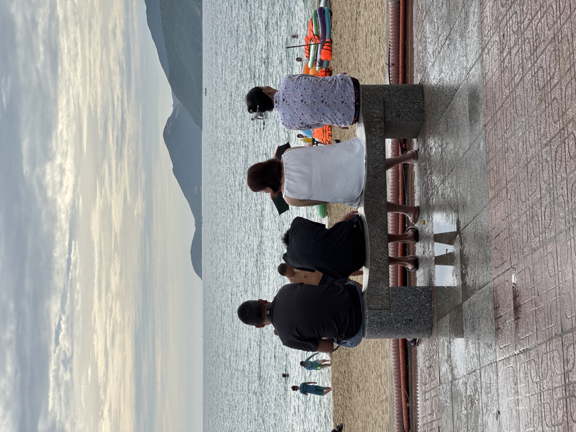 Busy morning along Nha Trang's beach and vendor-lined sidewalks