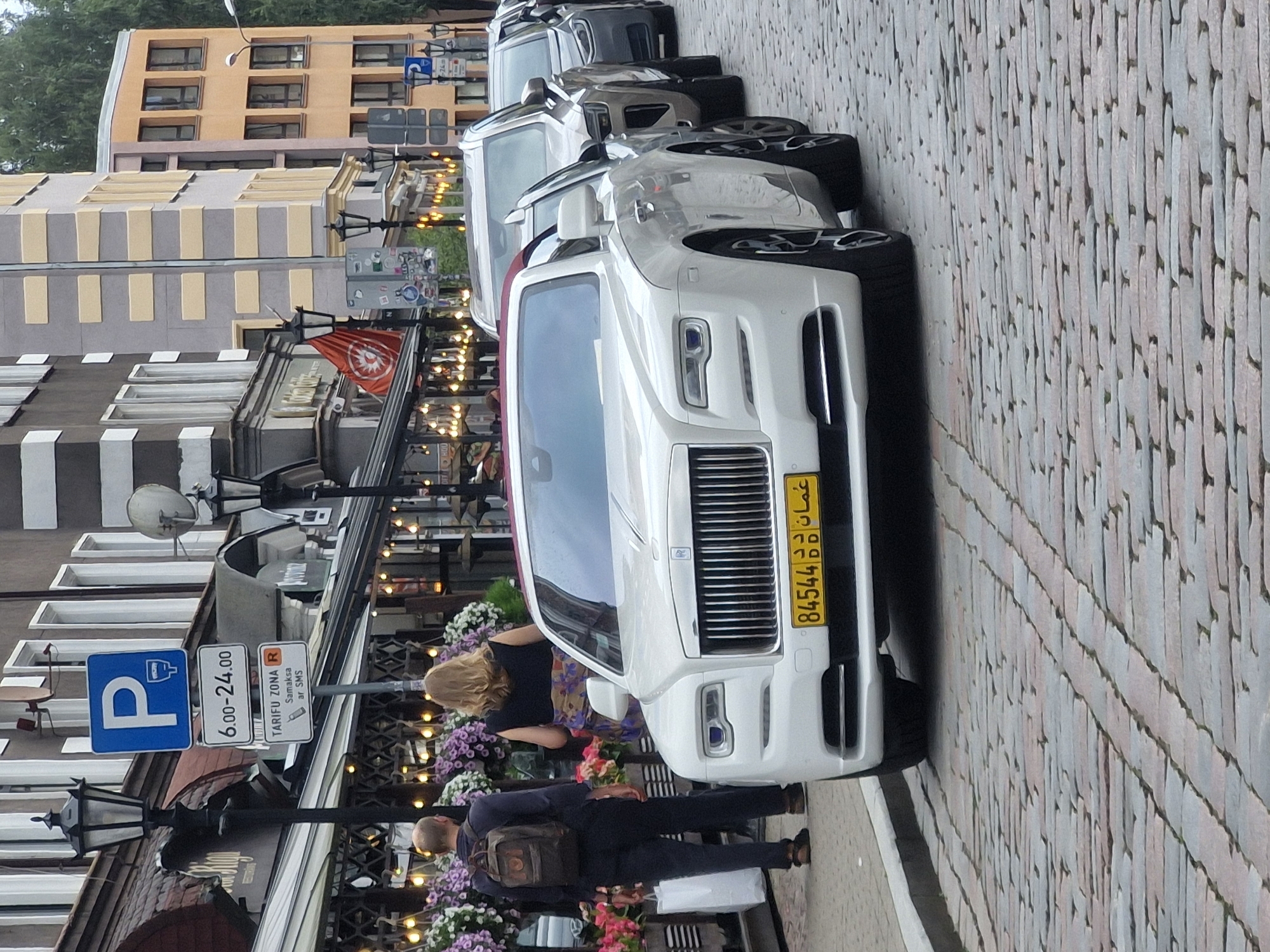 Rolls-Royce and rhino sculpture on Riga's cobblestone streets