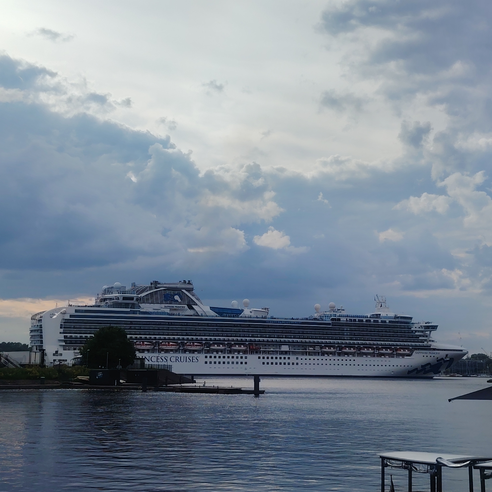 Cruise ships dock at Riga waterfront during busy afternoon