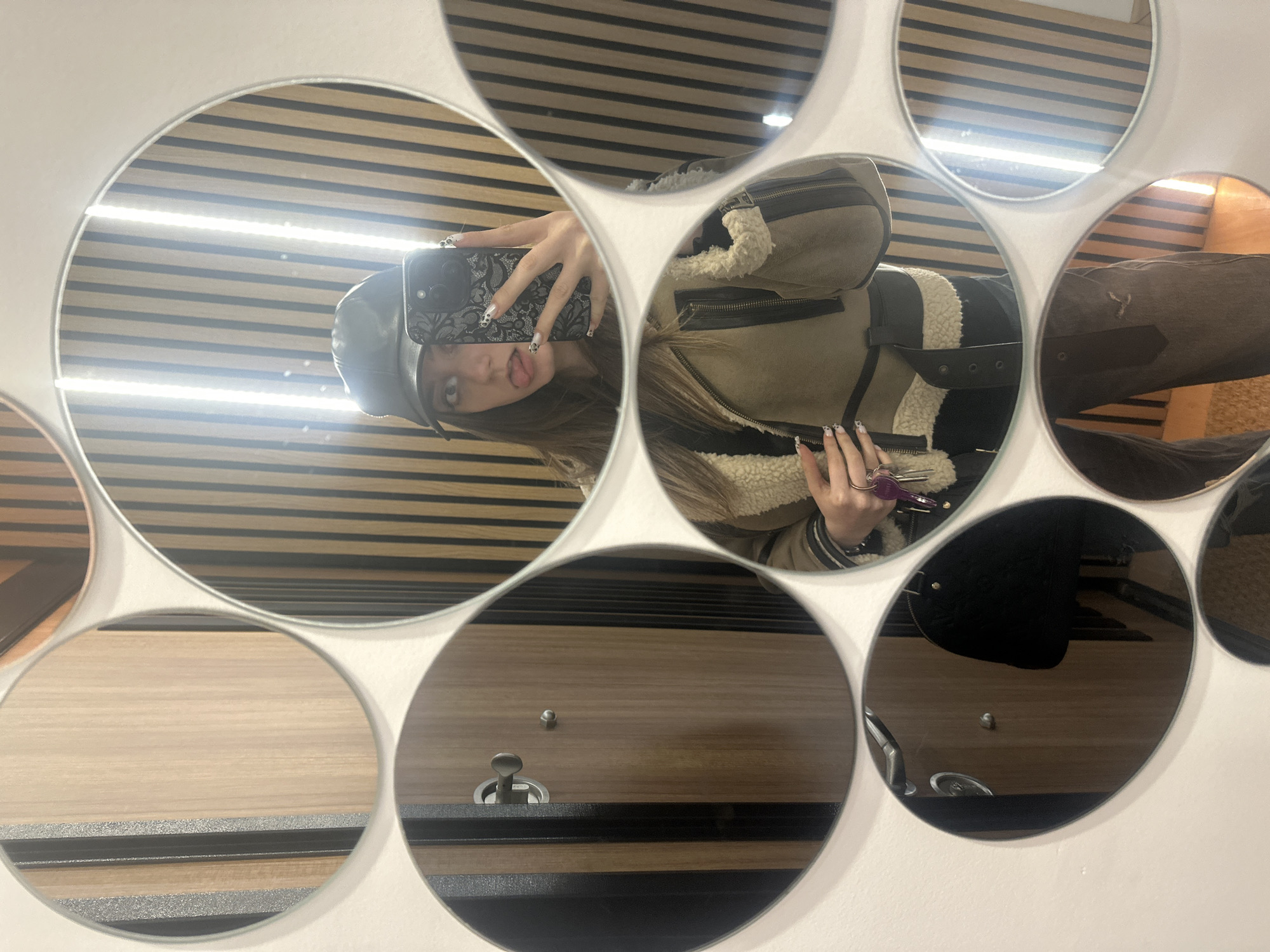 Person takes selfie at mirror wall in Targovishte